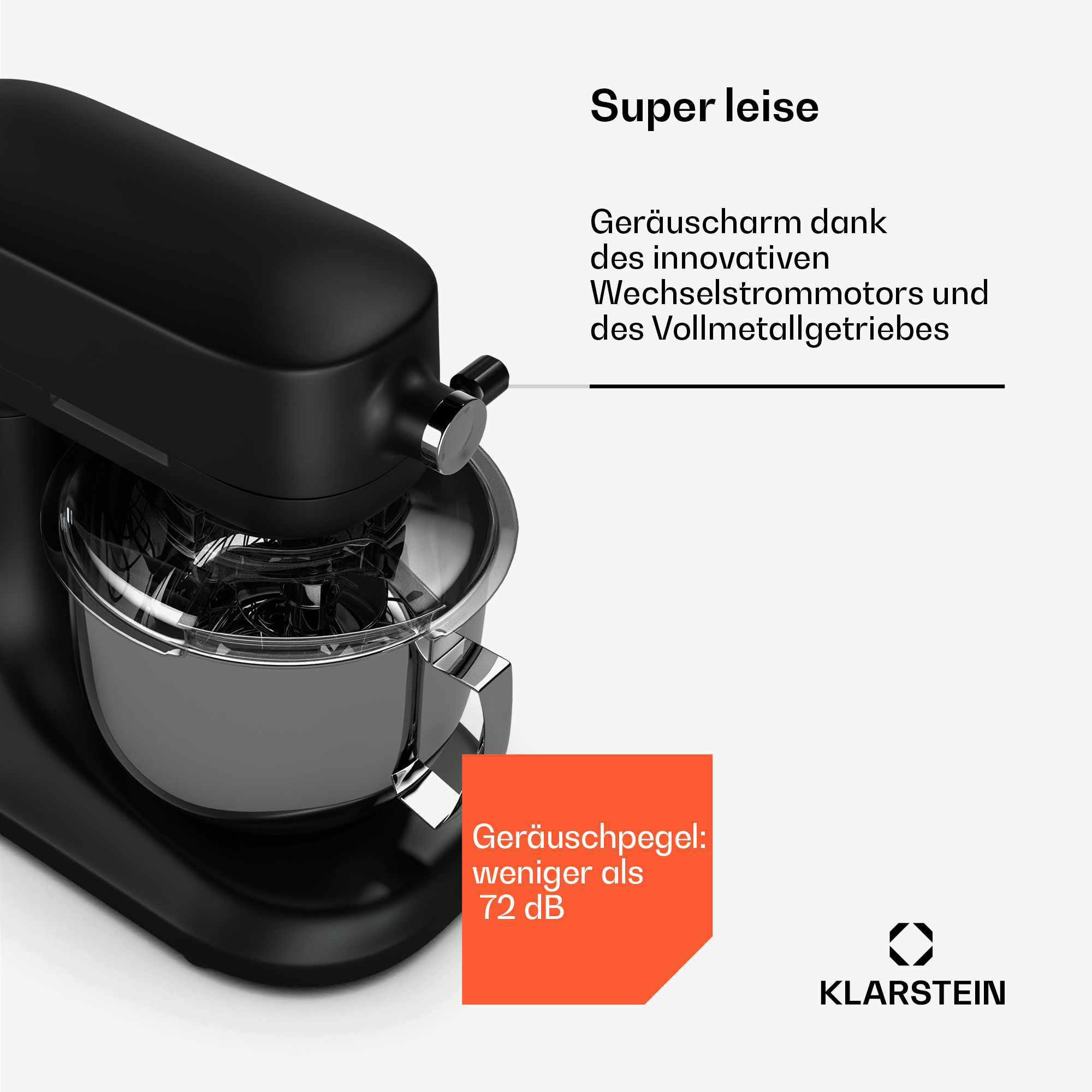 Schwarzer Küchenmixer. Edelstahlschüssel. Text auf Deutsch auf orangefarbenem Etikett.