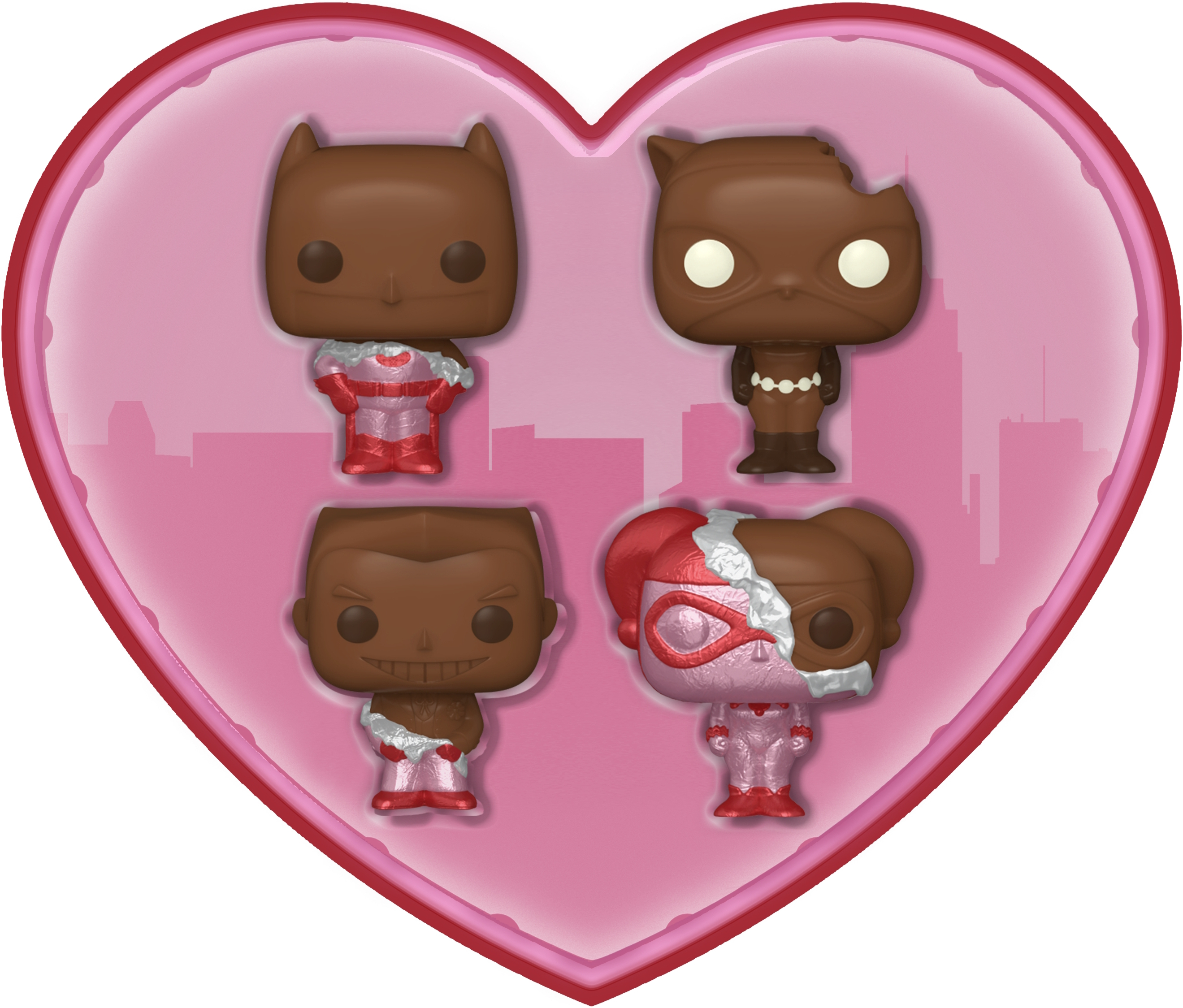 Figuras de Funko Pop en una caja en forma de corazón. Son Batman, The Joker y Harley Quinn.