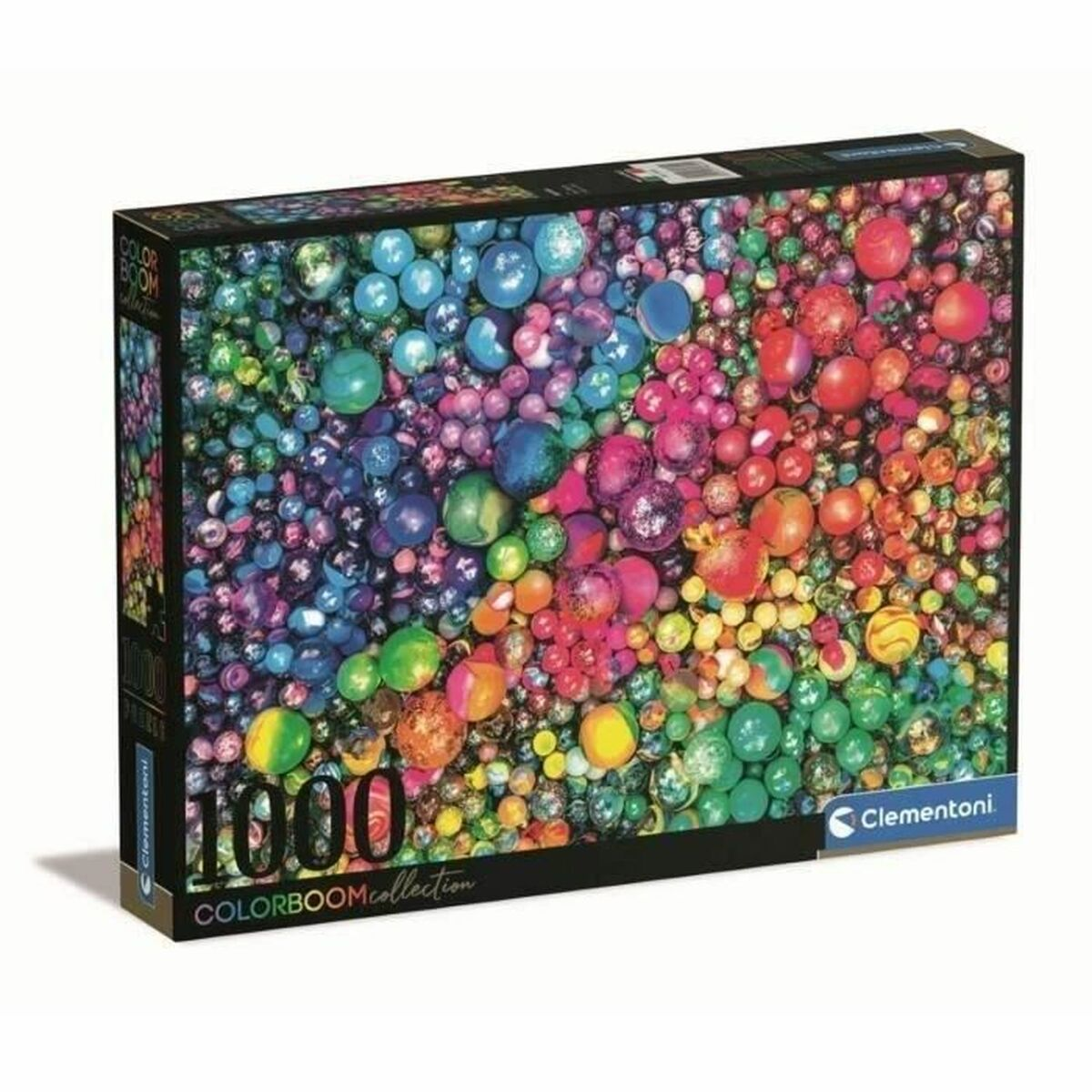 Caja de rompecabezas con esferas coloridas de varios tamaños. Marca y logo en la esquina inferior derecha.