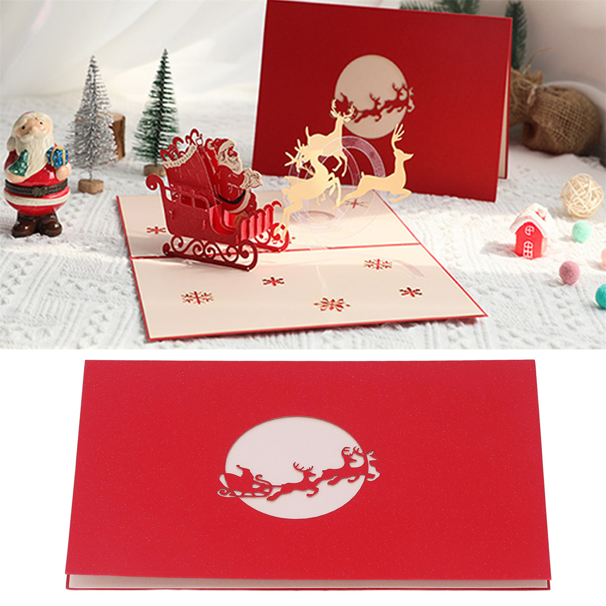 Rote Weihnachtskarte mit Santa und Rentieren. Die Karte ist geöffnet, mit einer kleineren Karte dahinter.