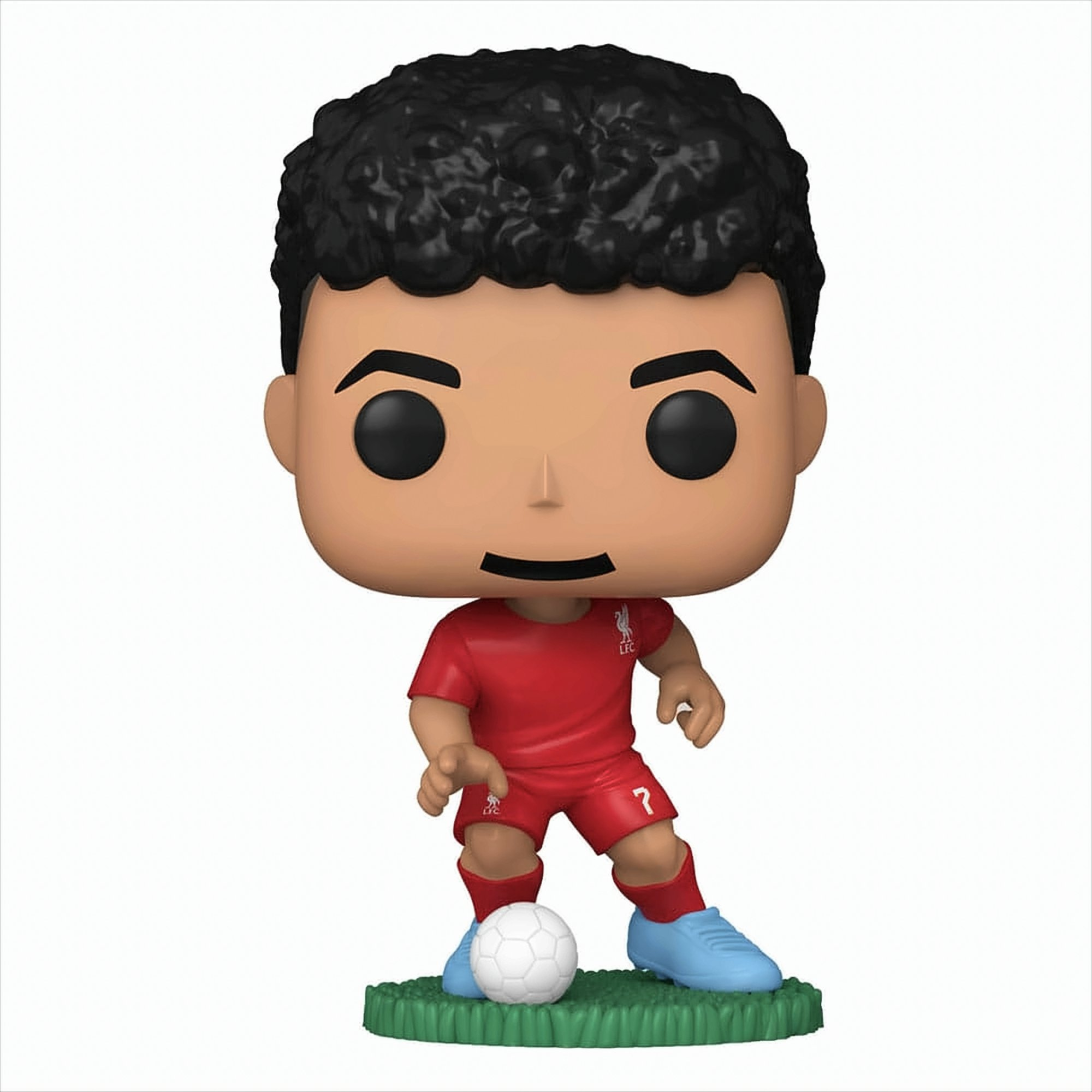Una figura Funko Pop di un calciatore in divisa rossa. Sfondo bianco.