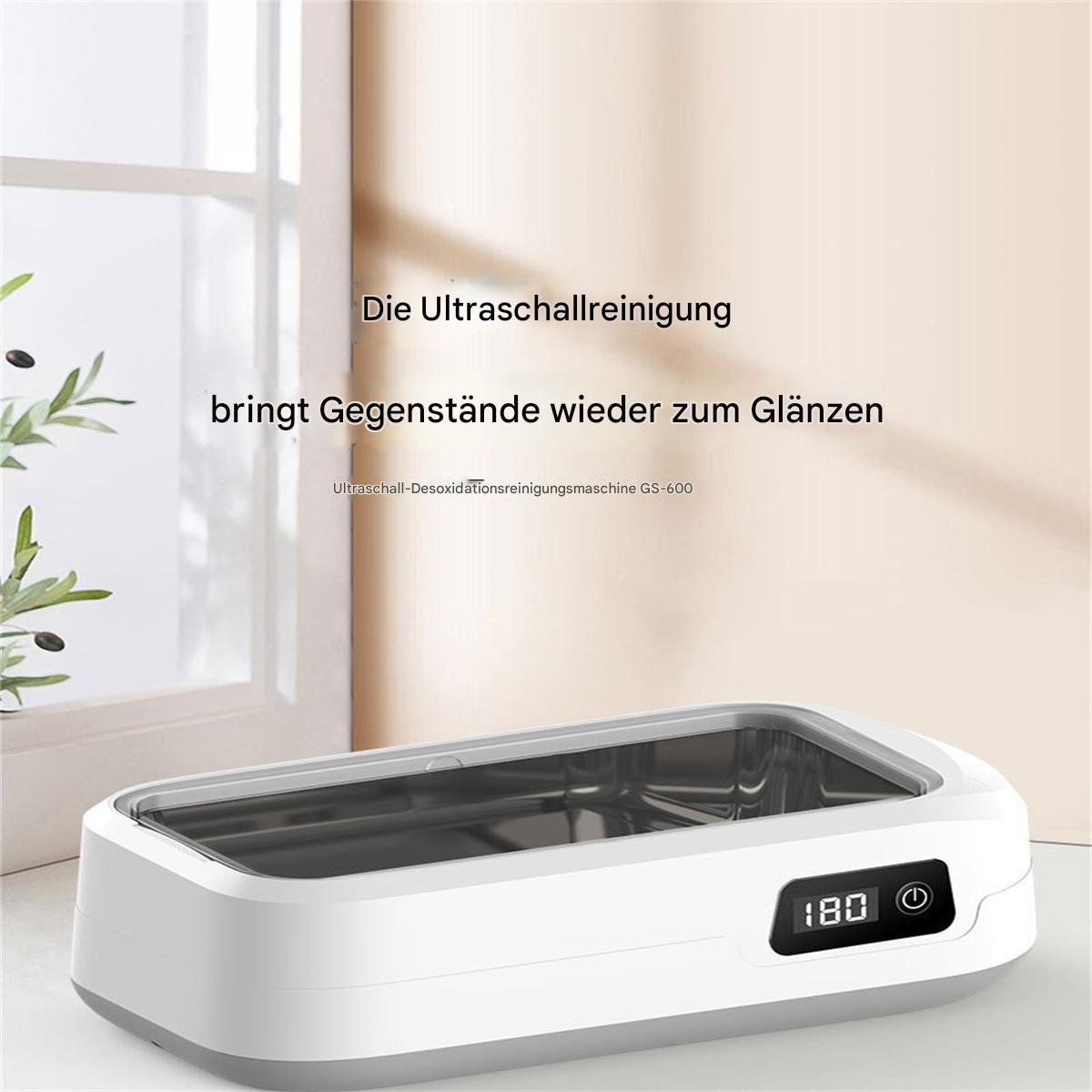 Ein Ultraschallreinigungsgerät mit Digitalanzeige, Text darüber.