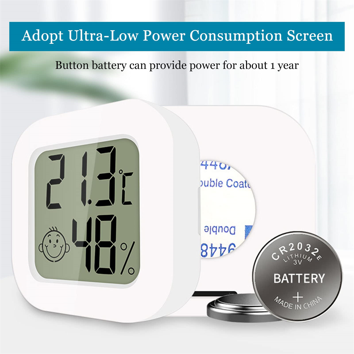Weißes digitales Thermometer mit schwarzem Bildschirm. Eine Batterie und ein weißer Hintergrund.
