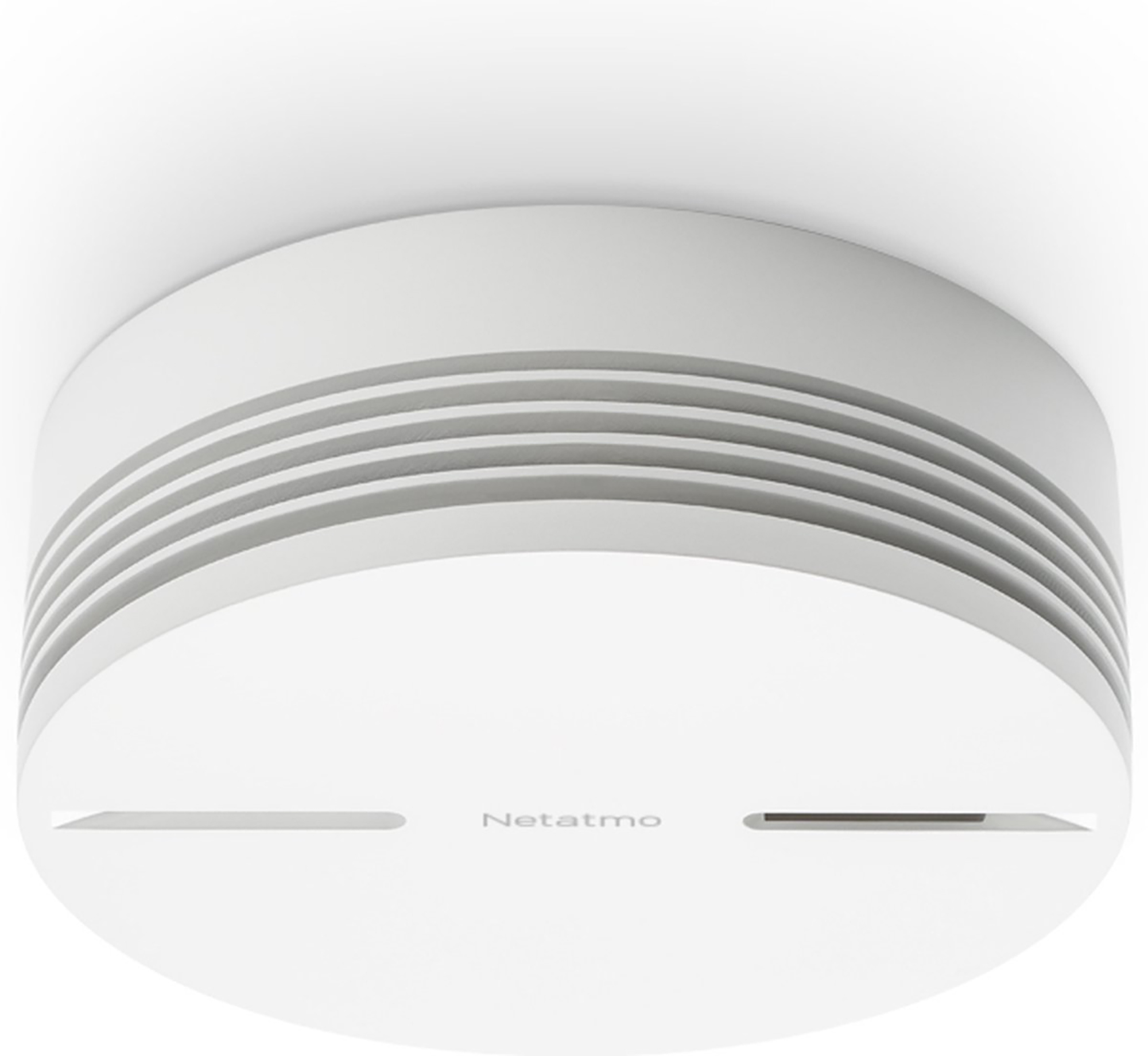 White smoke detector. It has a circular design with horizontal slits and the 'Netatmo' logo.