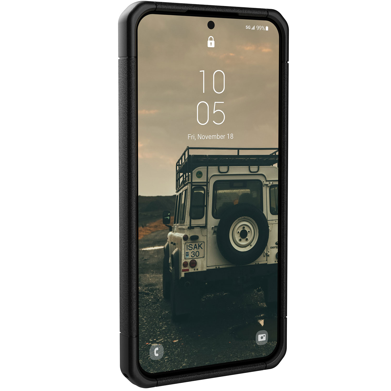 A smartphone in a black case displays a car on a road, with a date and time.