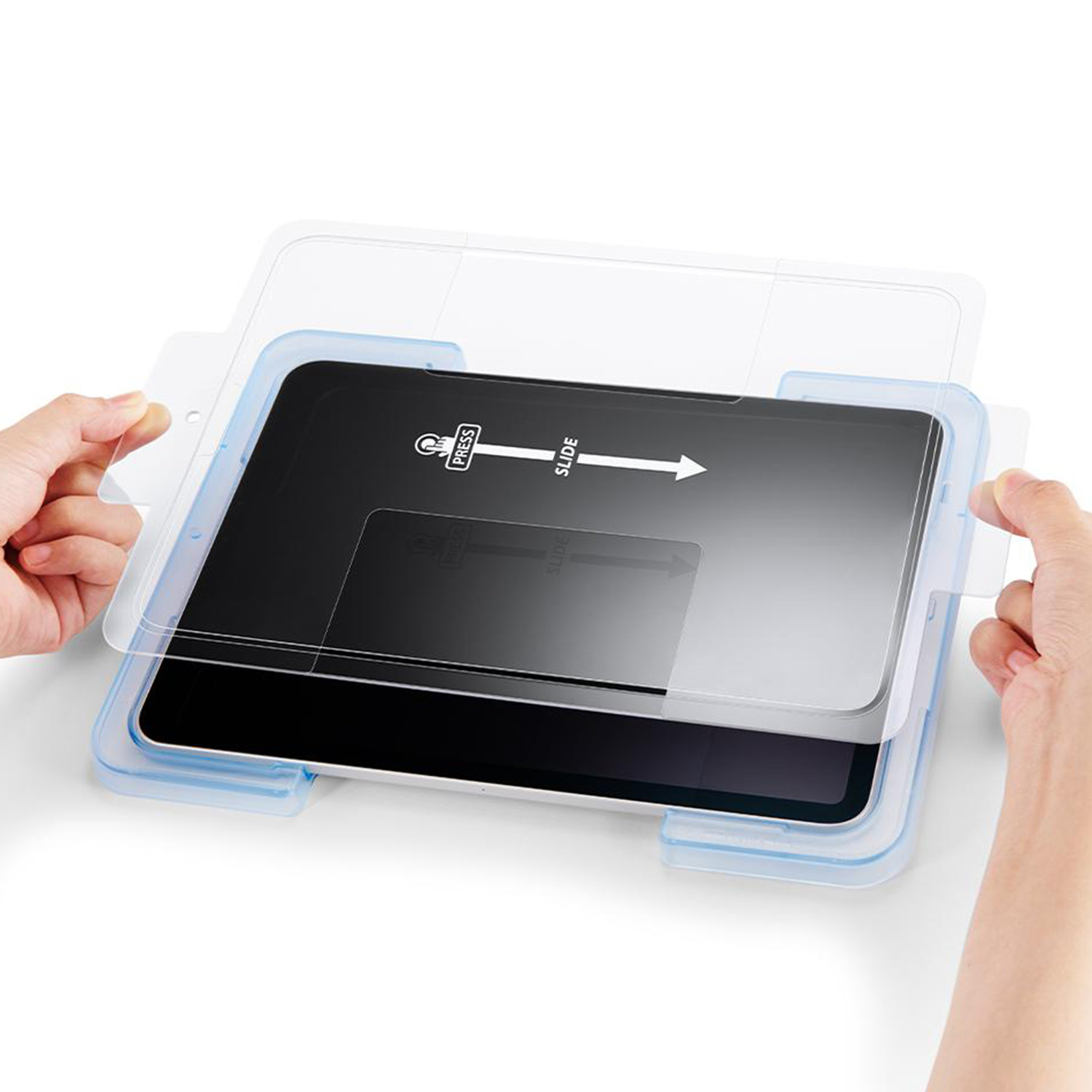 Ręce trzymają osłonę ekranu, przesuwając ją na czarny tablet. Etykiety 'Press', 'Slide'.