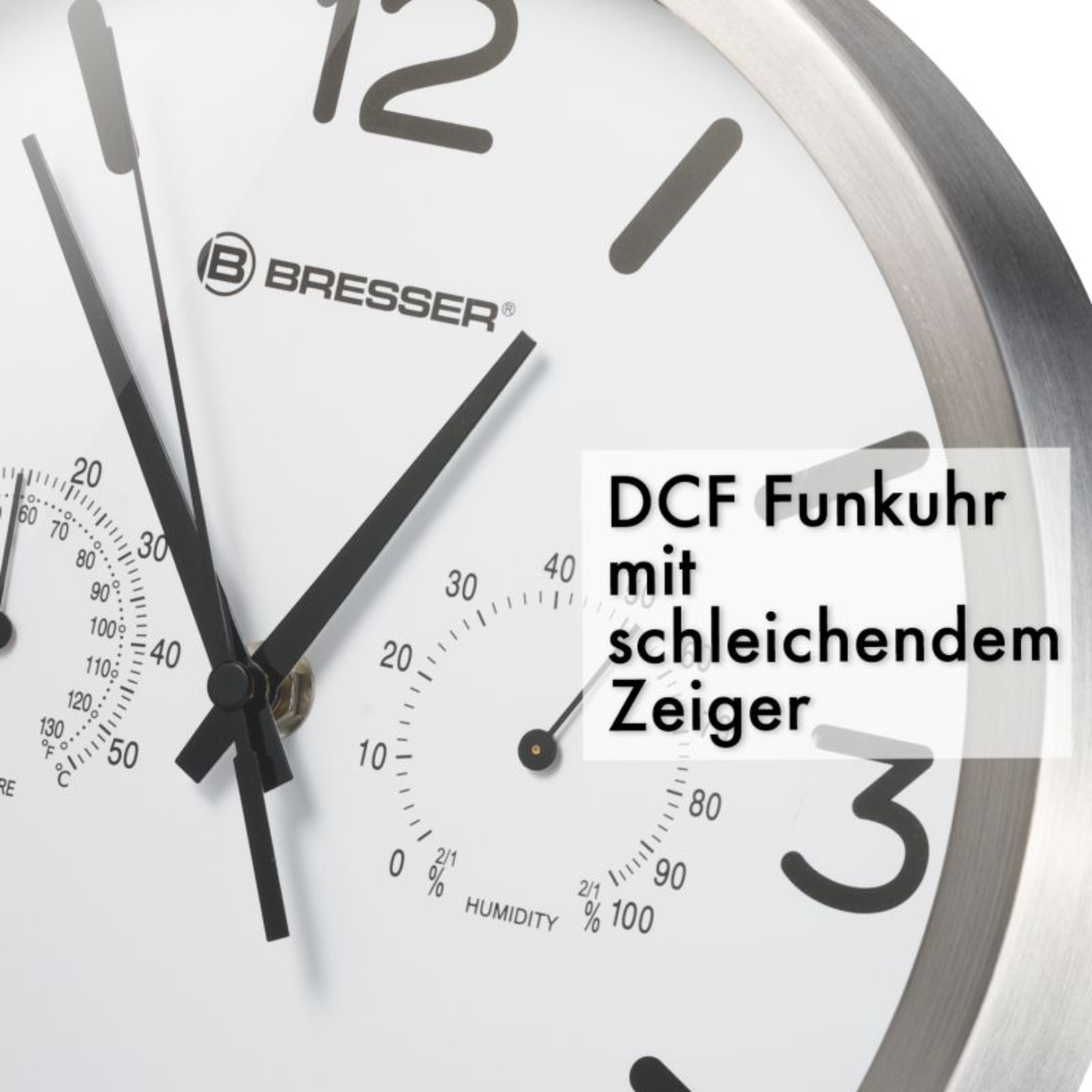 Nahaufnahme eines Zifferblatts mit Text 'DCF Funkur mit schleichendem Zeiger'.