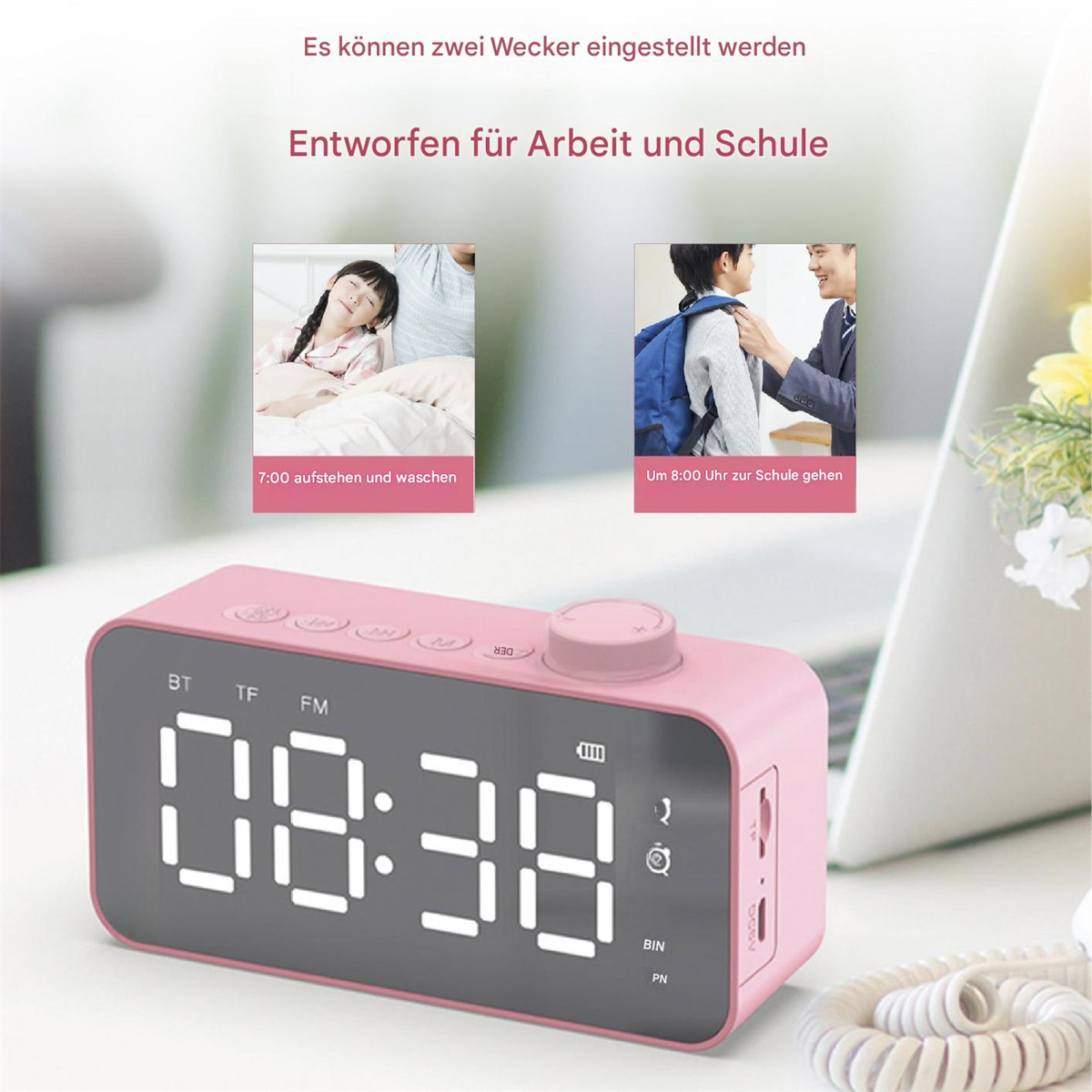 Ein rosa Wecker mit digitaler Anzeige und einigen Bildern oben drauf.
