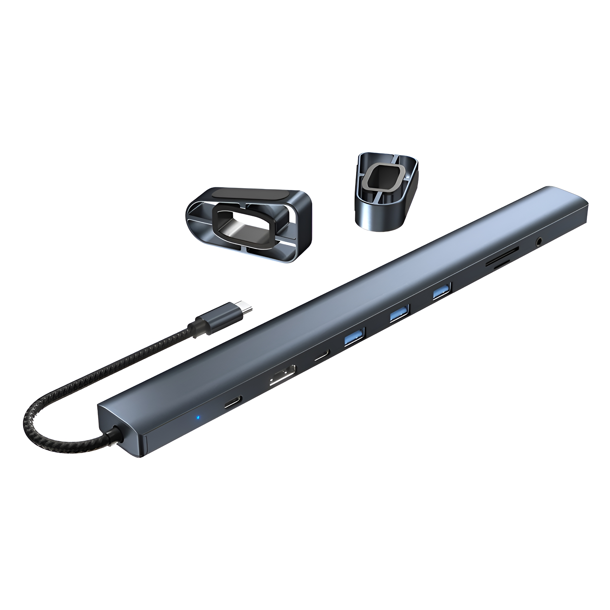 Ein dunkelgrauer USB-C-Hub mit mehreren Anschlüssen und einem angeschlossenen Kabel. Einige Zubehörteile sind ebenfalls sichtbar.