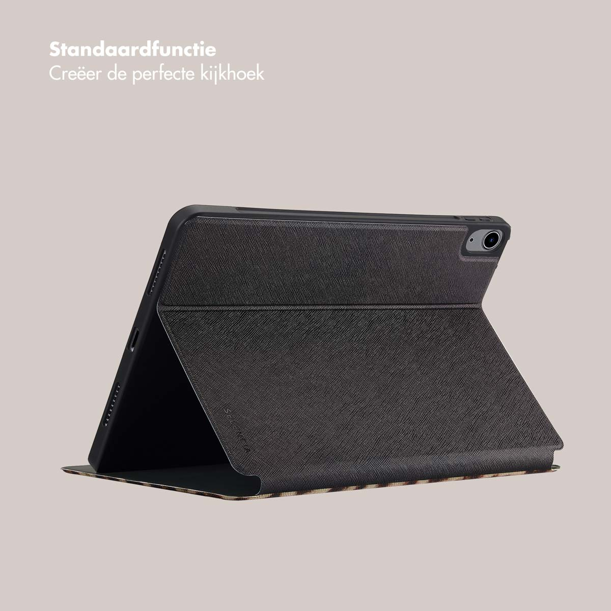Tablet case, open on a light surface.  Dark gray exterior, showing the interior in a patterned design.