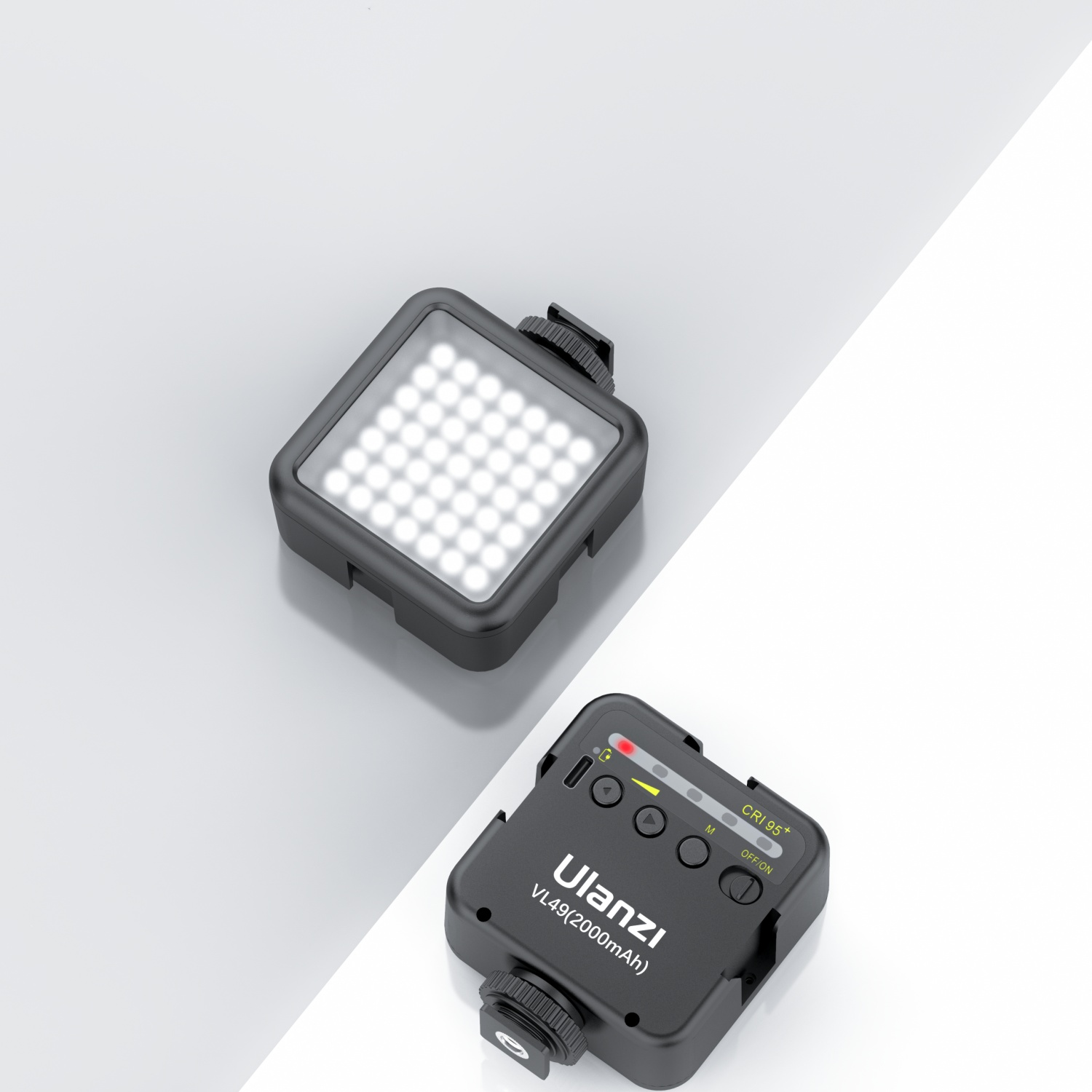 Due luci LED nere, una accesa, su una superficie sfumata bianca e grigia.