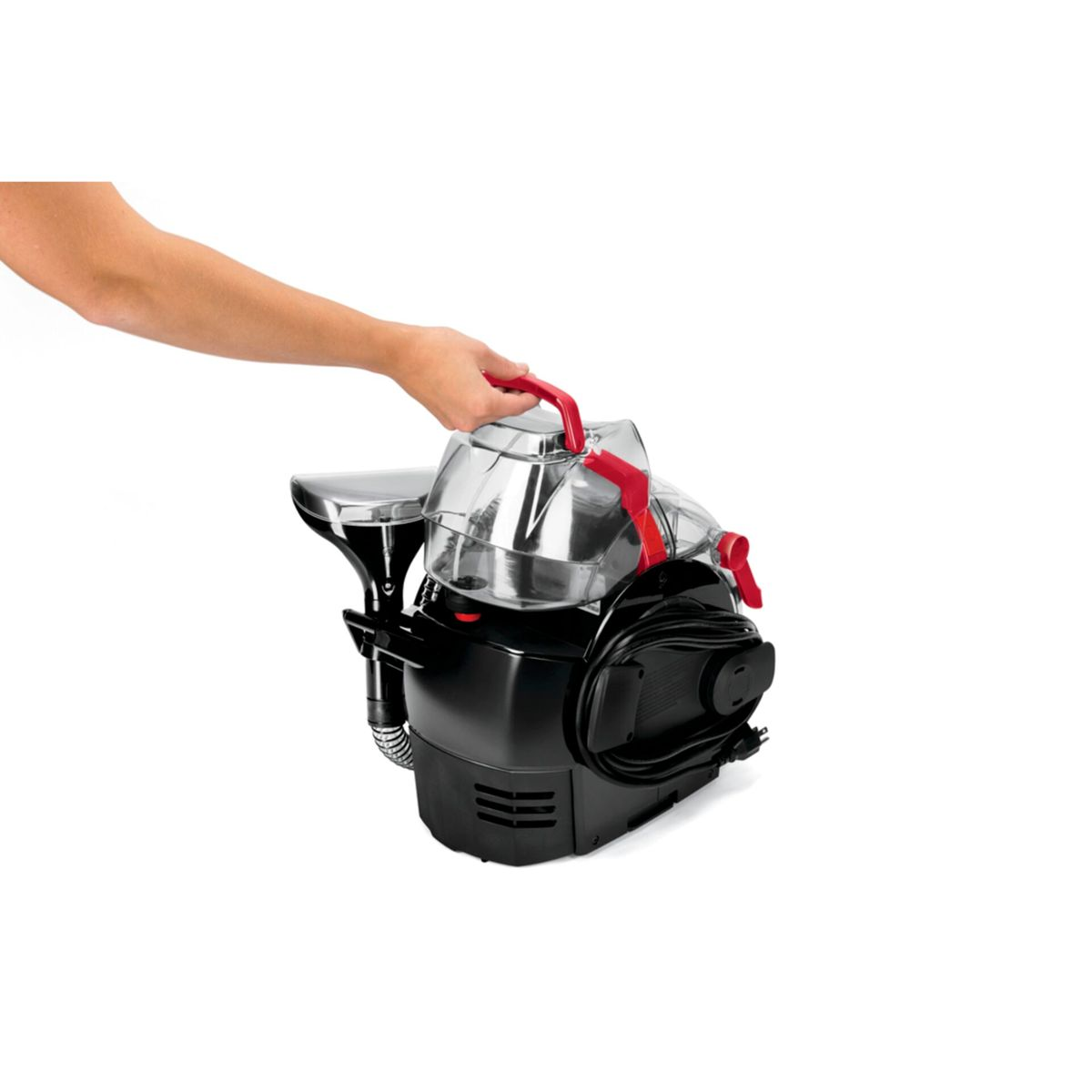 Hand hebt roten Griff eines schwarzen Geräts mit transparentem Tank.