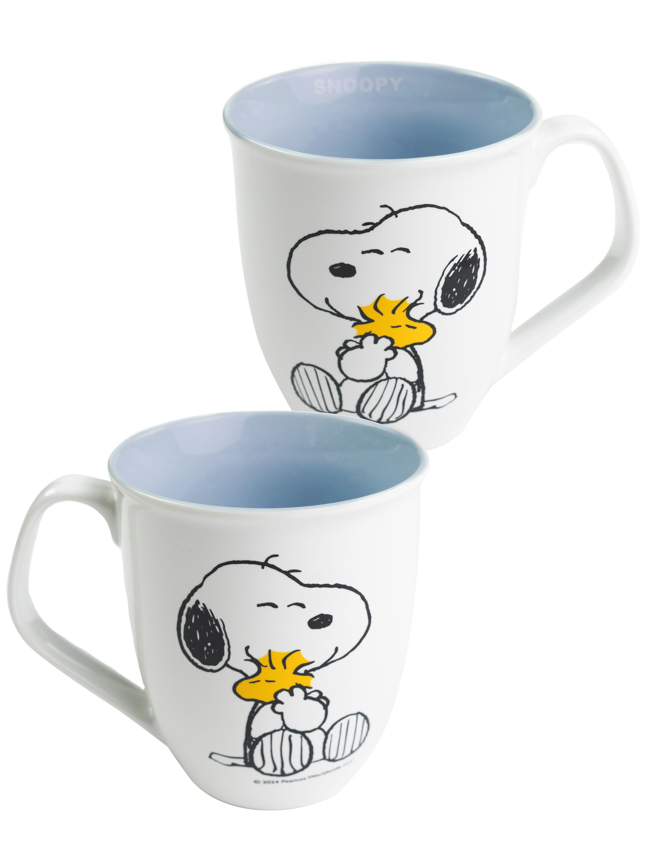 Zwei weiße Snoopy-Tassen mit blauem Innenraum, Snoopy hält einen gelben Vogel.