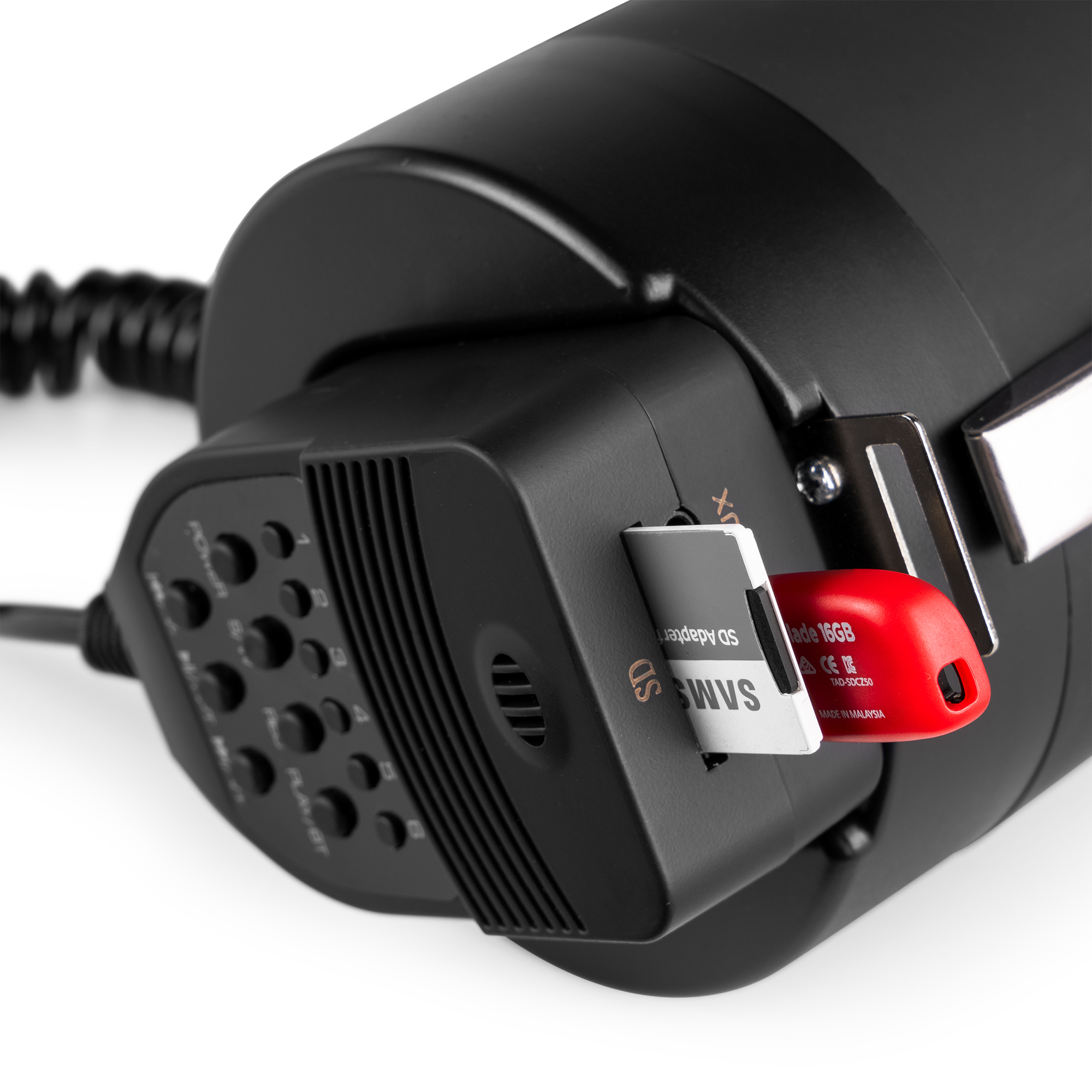 A camera flash with an SD card inserted, and a red card reader. Black background.