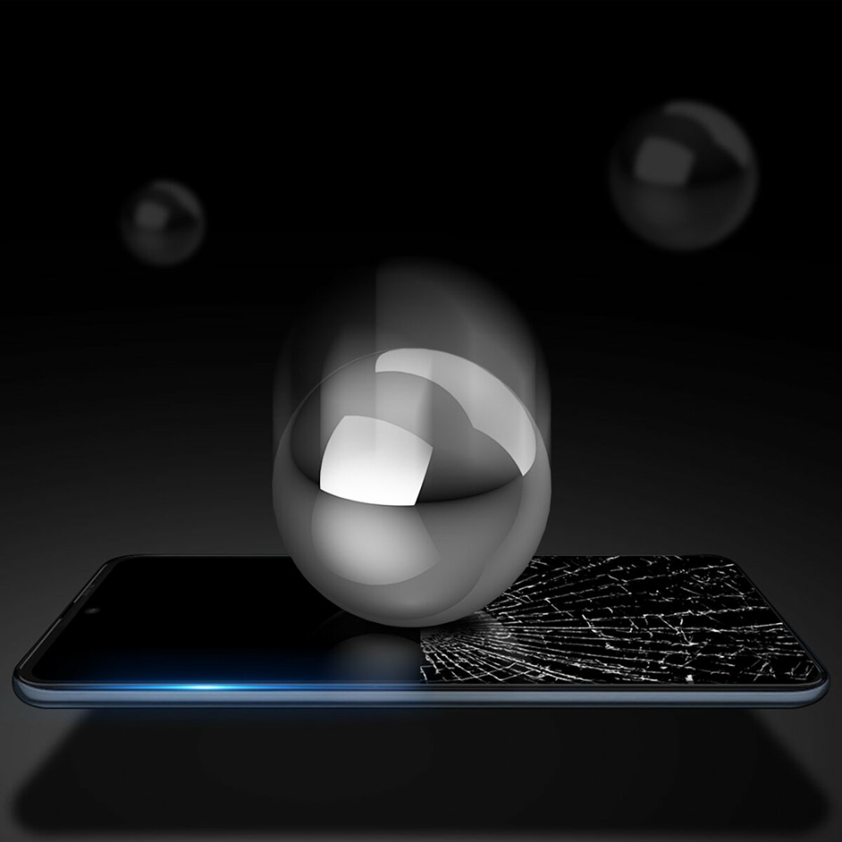 Ein Telefonbildschirm, der einen gesprungenen Bildschirm zeigt, der von einer Kugel geschützt wird.