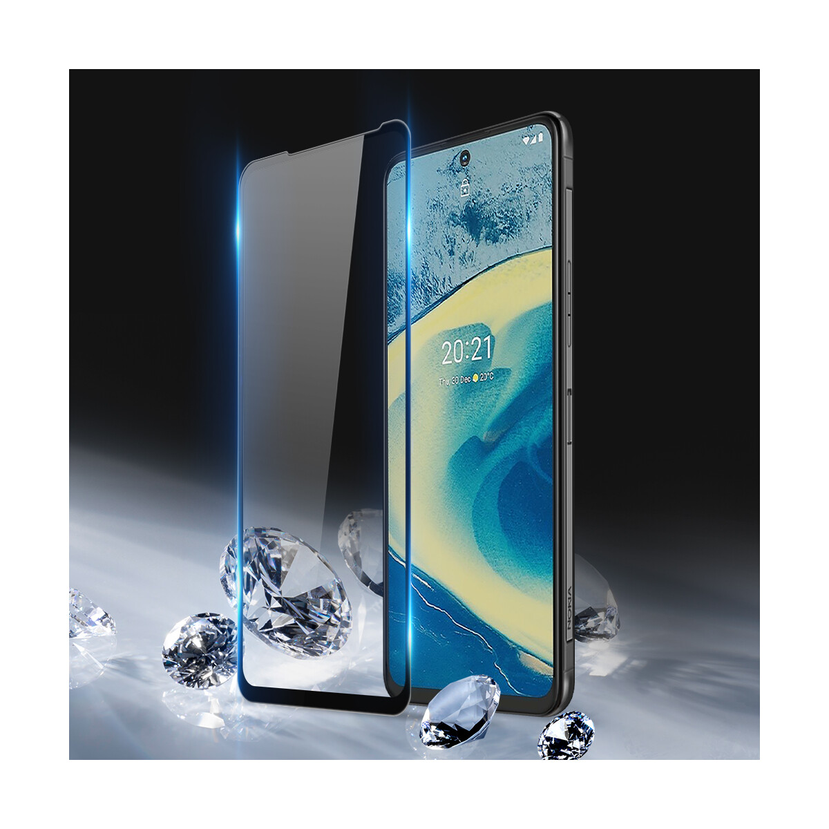Smartphone mit Displayschutz. Diamanten liegen auf glänzender Oberfläche.