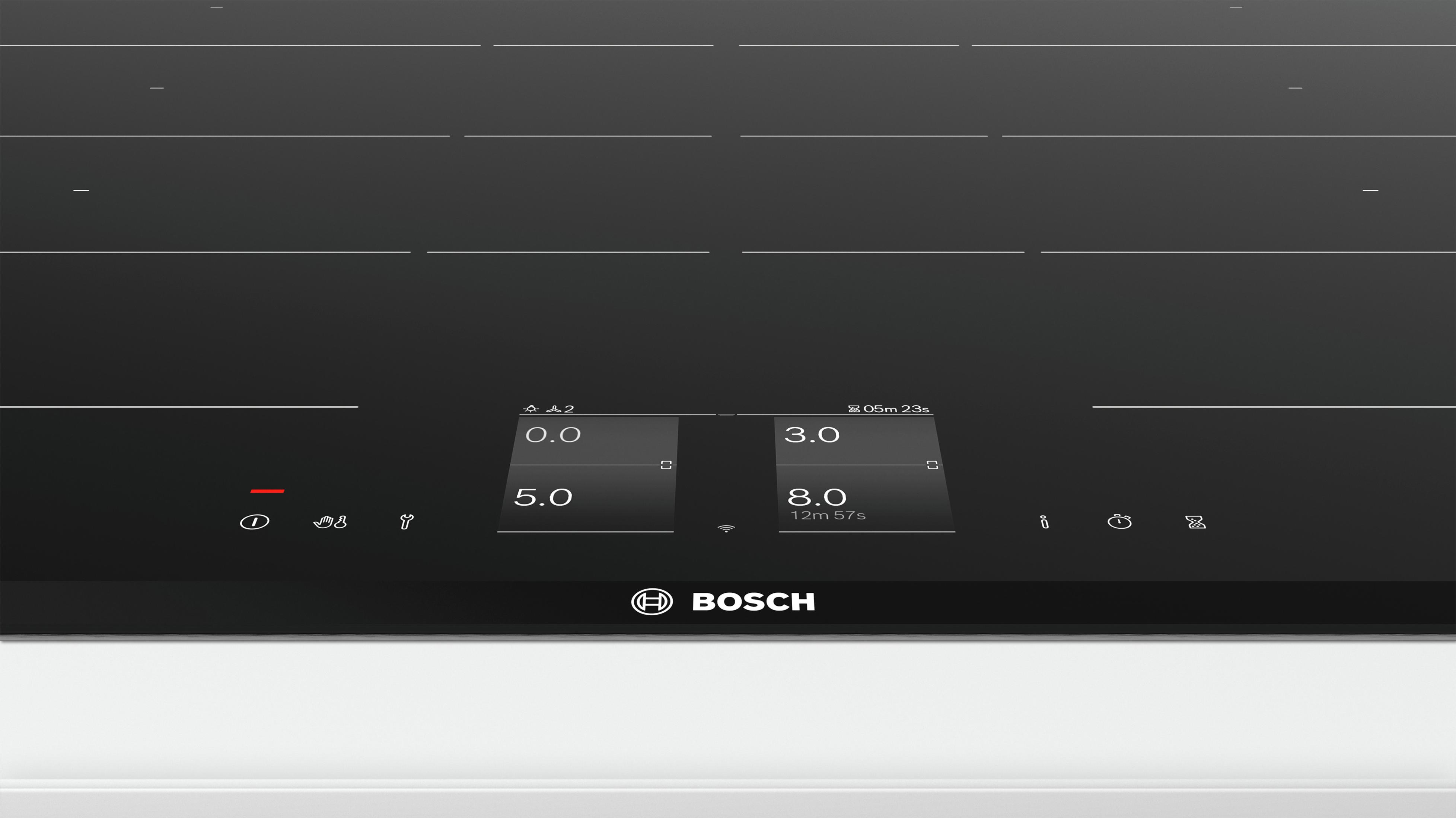Placa de inducción negra con pantalla digital que muestra números e iconos.