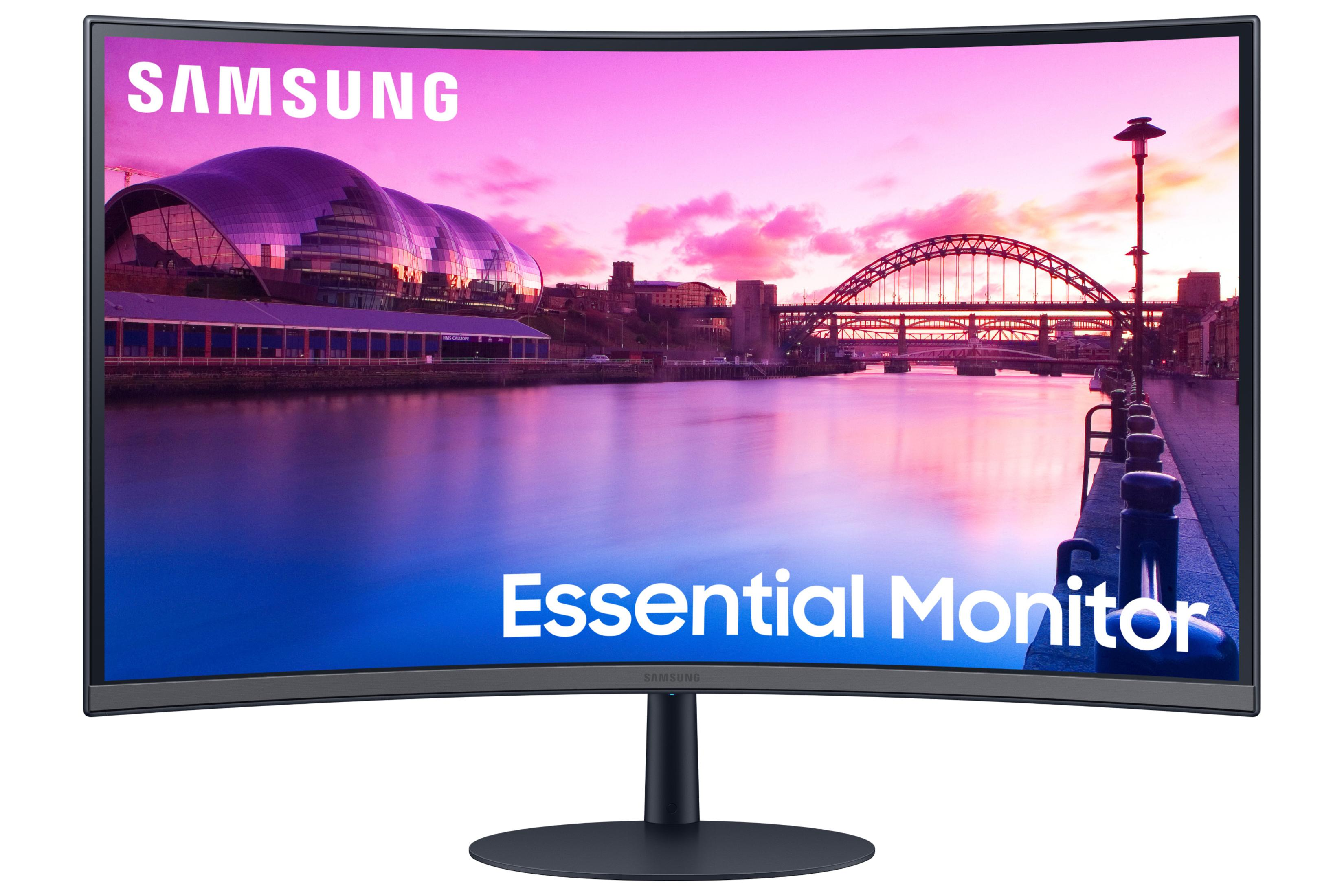 Monitor Samsung curvo che mostra lo skyline di una città al tramonto.