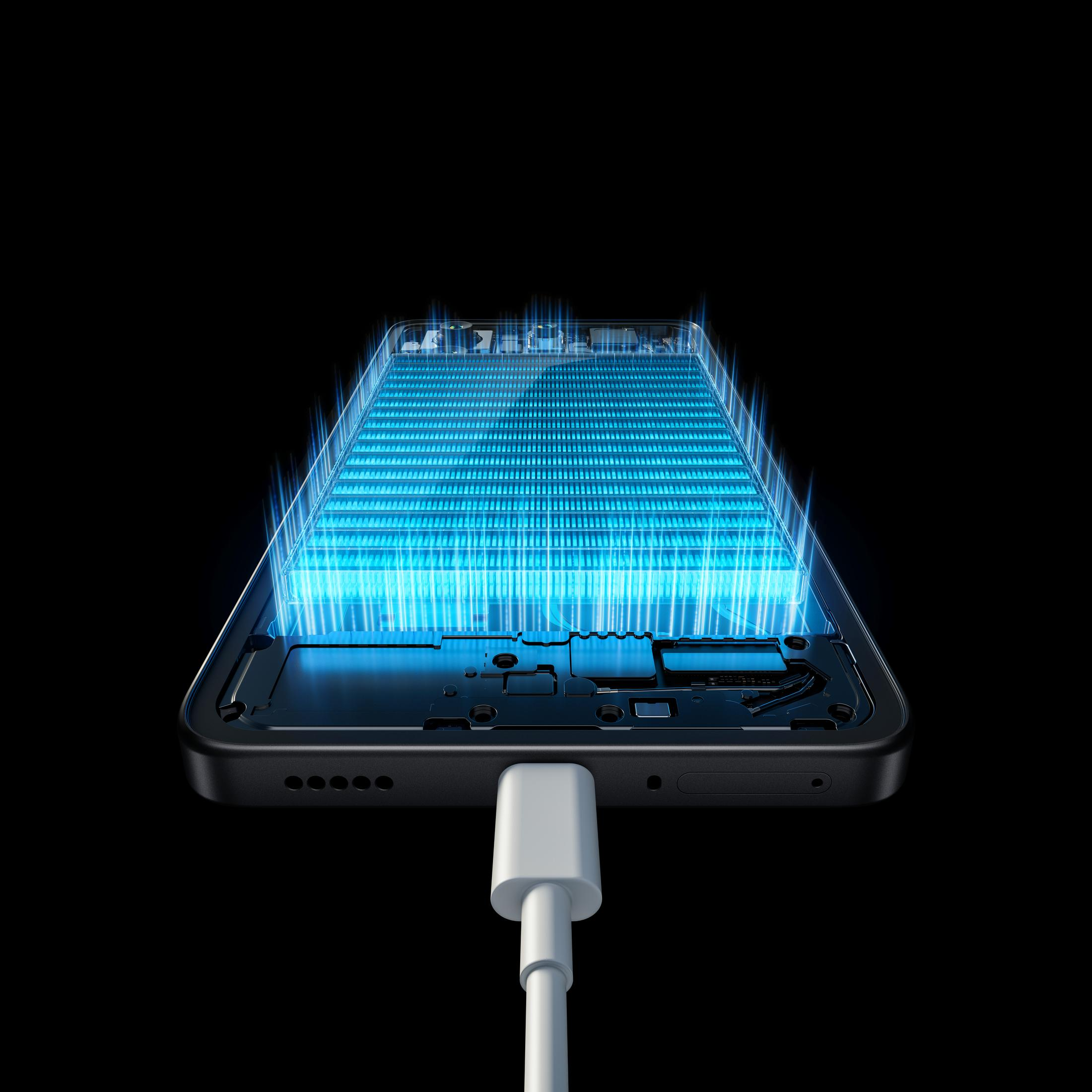 Wnętrze smartfona podświetlone na niebiesko. Kabel ładujący podłączony na dole urządzenia.