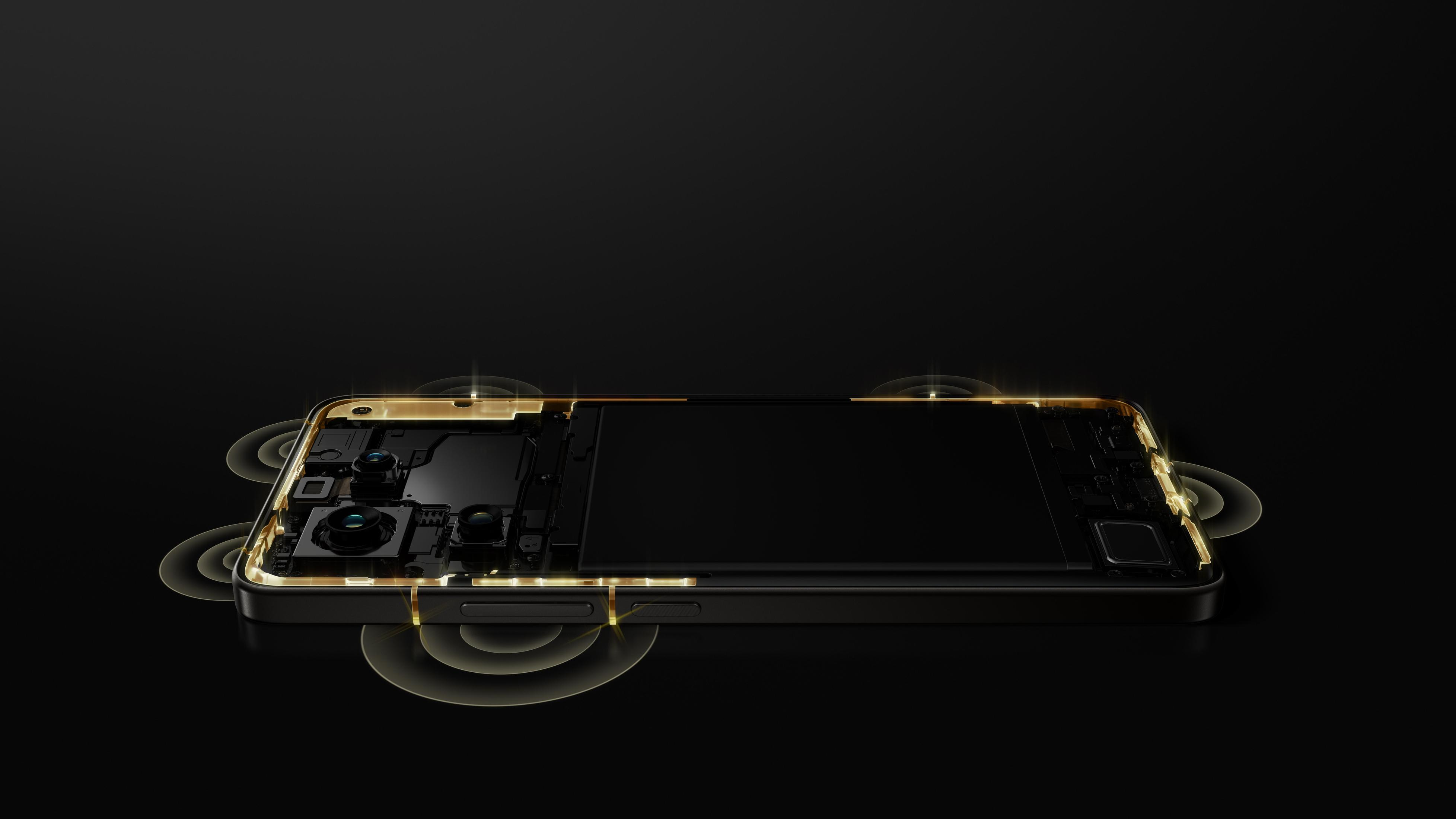 Telefon z przekrojem pokazującym wewnętrzne komponenty, z świecącymi okręgami wokół krawędzi.