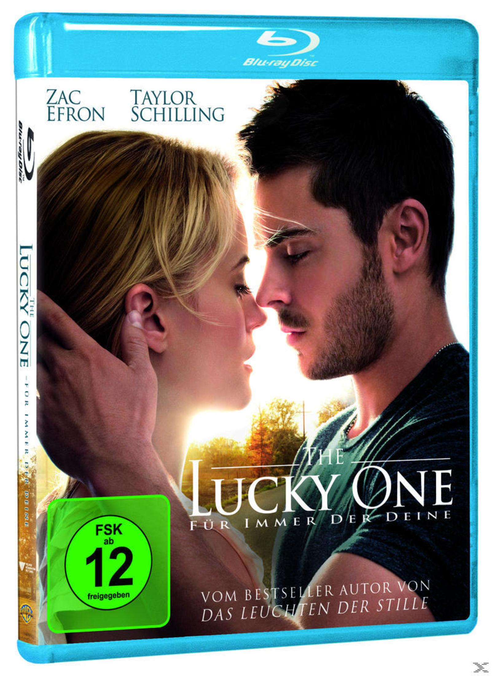 The Lucky One Blu-ray-Hülle mit einem sich umarmenden Paar. Der Hintergrund zeigt einen Sonnenuntergang.