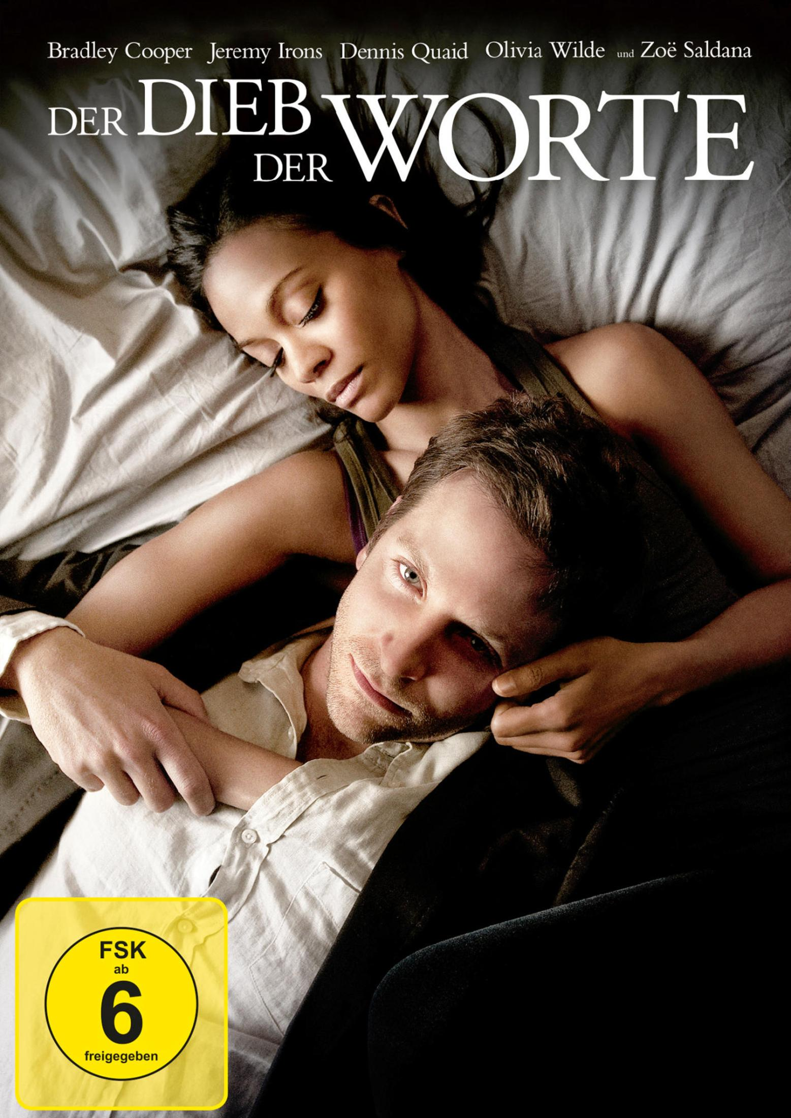 The Words DVD-Cover. Ein Mann und eine Frau umarmen sich, auf einem Bett liegend.