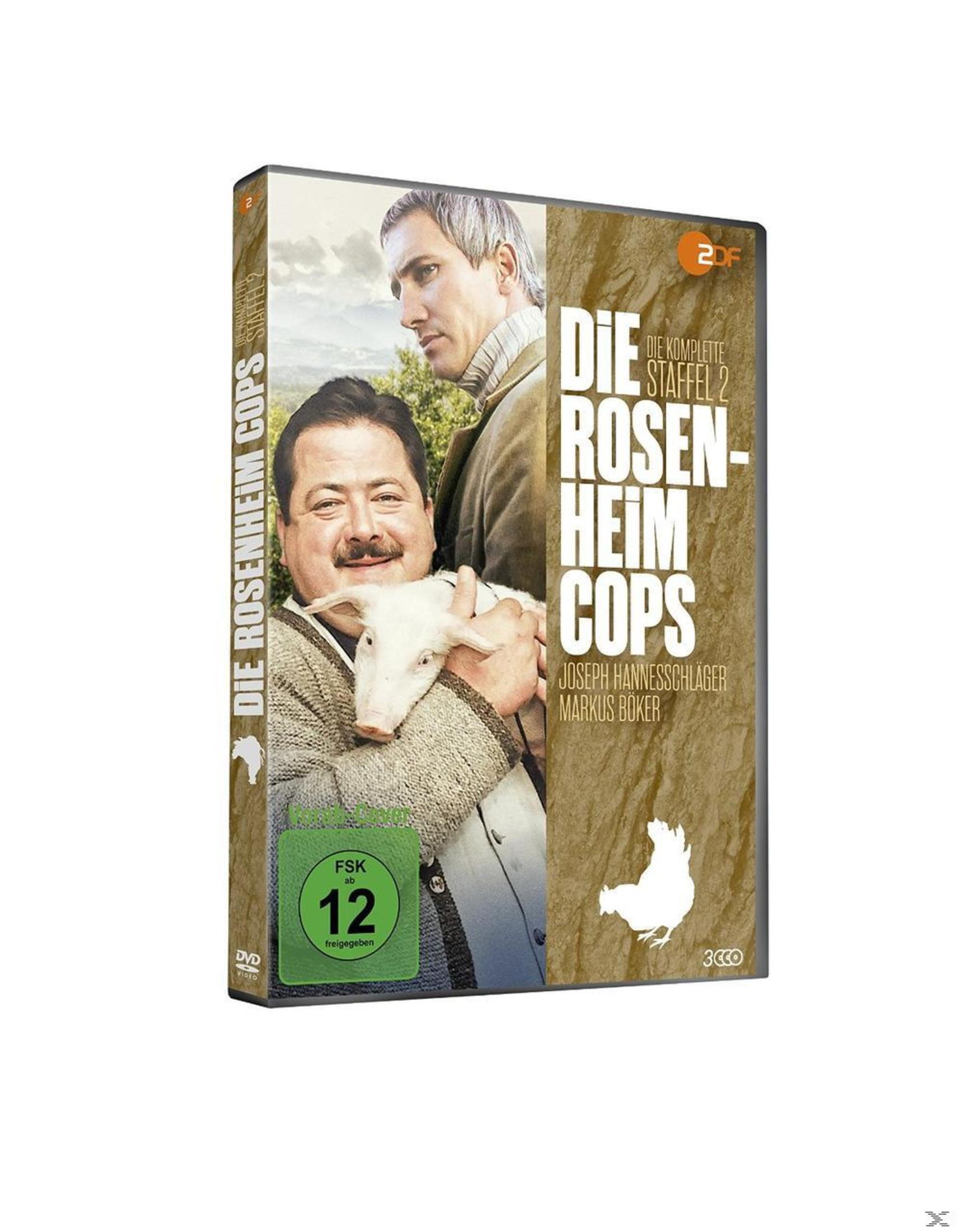 DVD-Cover von 'Die Rosenheim-Cops Staffel 2' mit zwei Männern, einem Schwein und einem grünen FSK 12-Sticker.
