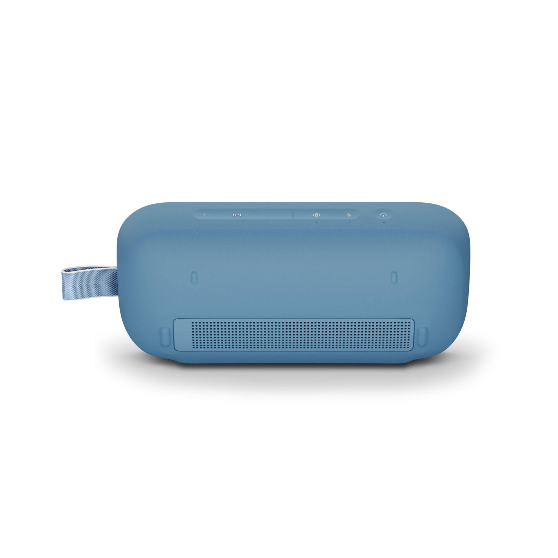 Un altavoz rectangular azul con botones en la parte superior y una correa de mano en el lateral.