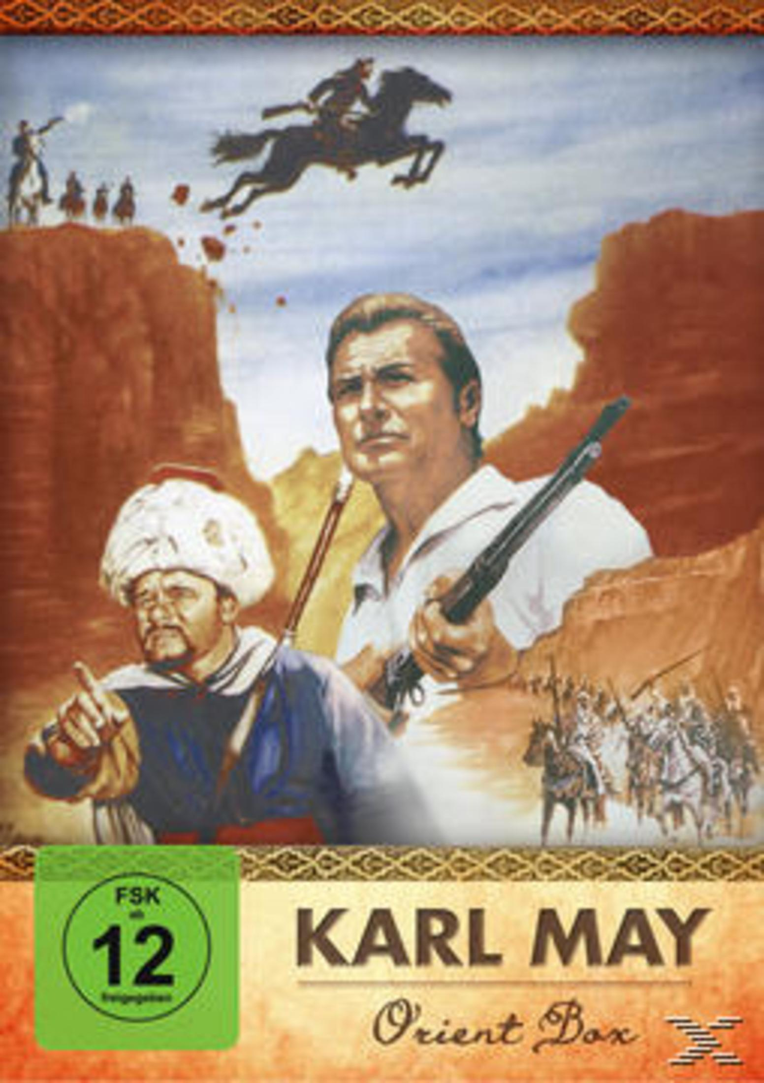 DVD-Cover Karl May Orient Box mit Männern, Gewehren und reitenden Figuren in einer bergigen Landschaft.