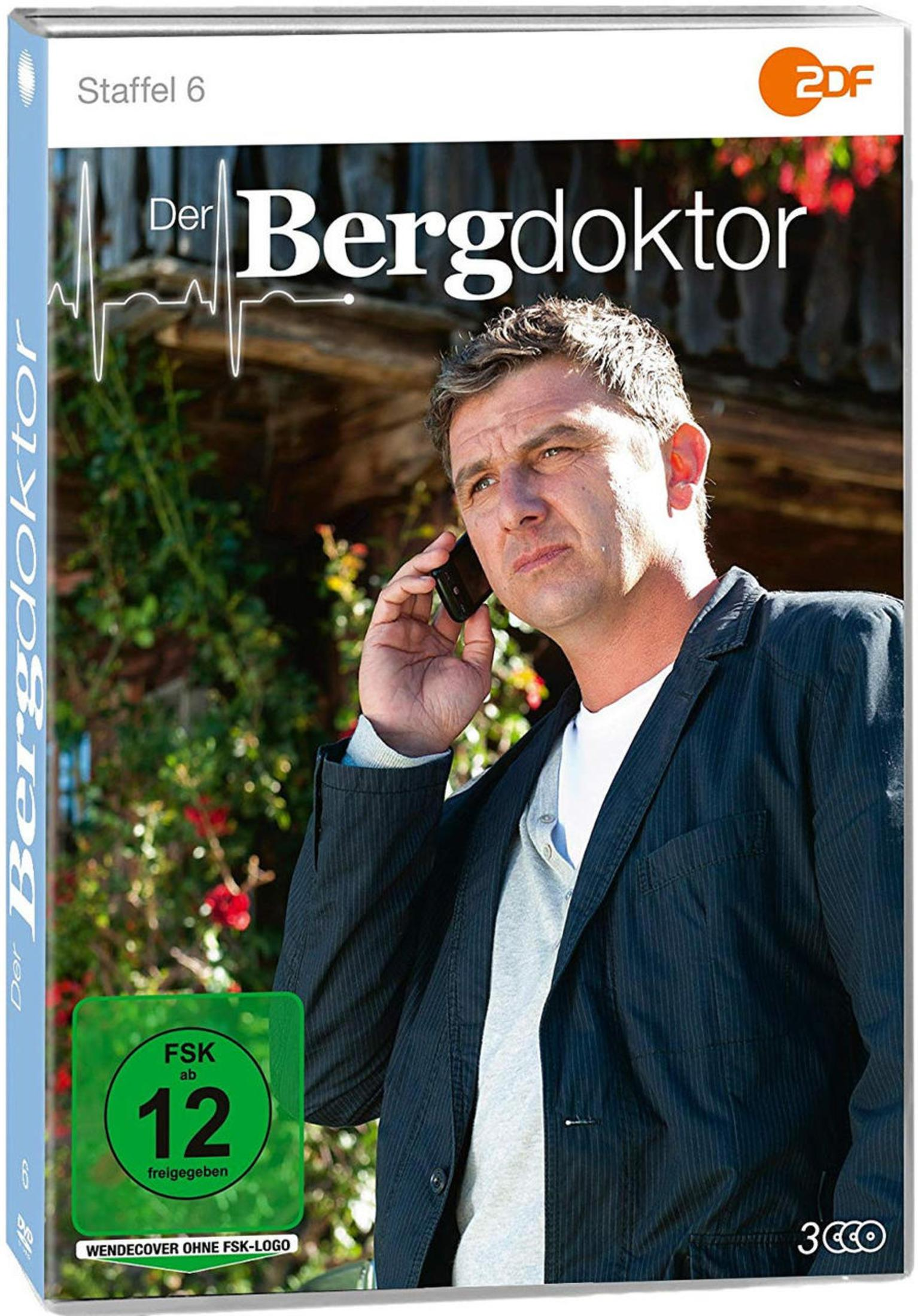 DVD-Cover von Der Bergdoktor, Staffel 6, mit einem Mann am Telefon vor einer Holzwand.