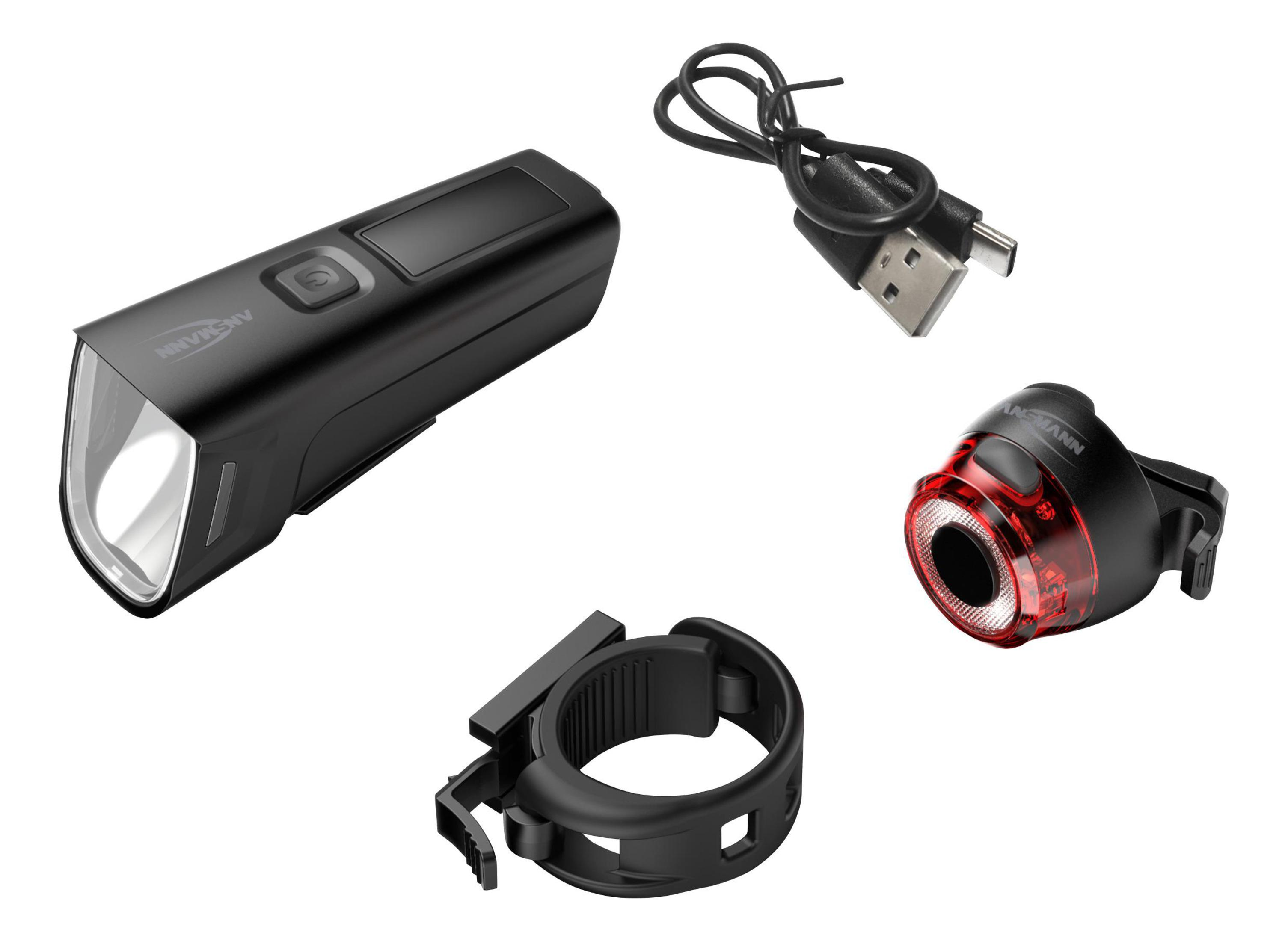 Schwarze Fahrradlichter und Halterung. Weißer Hintergrund.