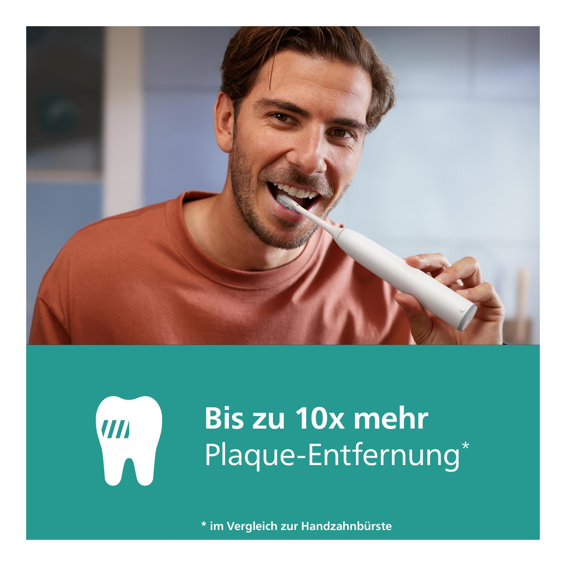 Un hombre se cepilla los dientes con un cepillo eléctrico, con texto abajo.