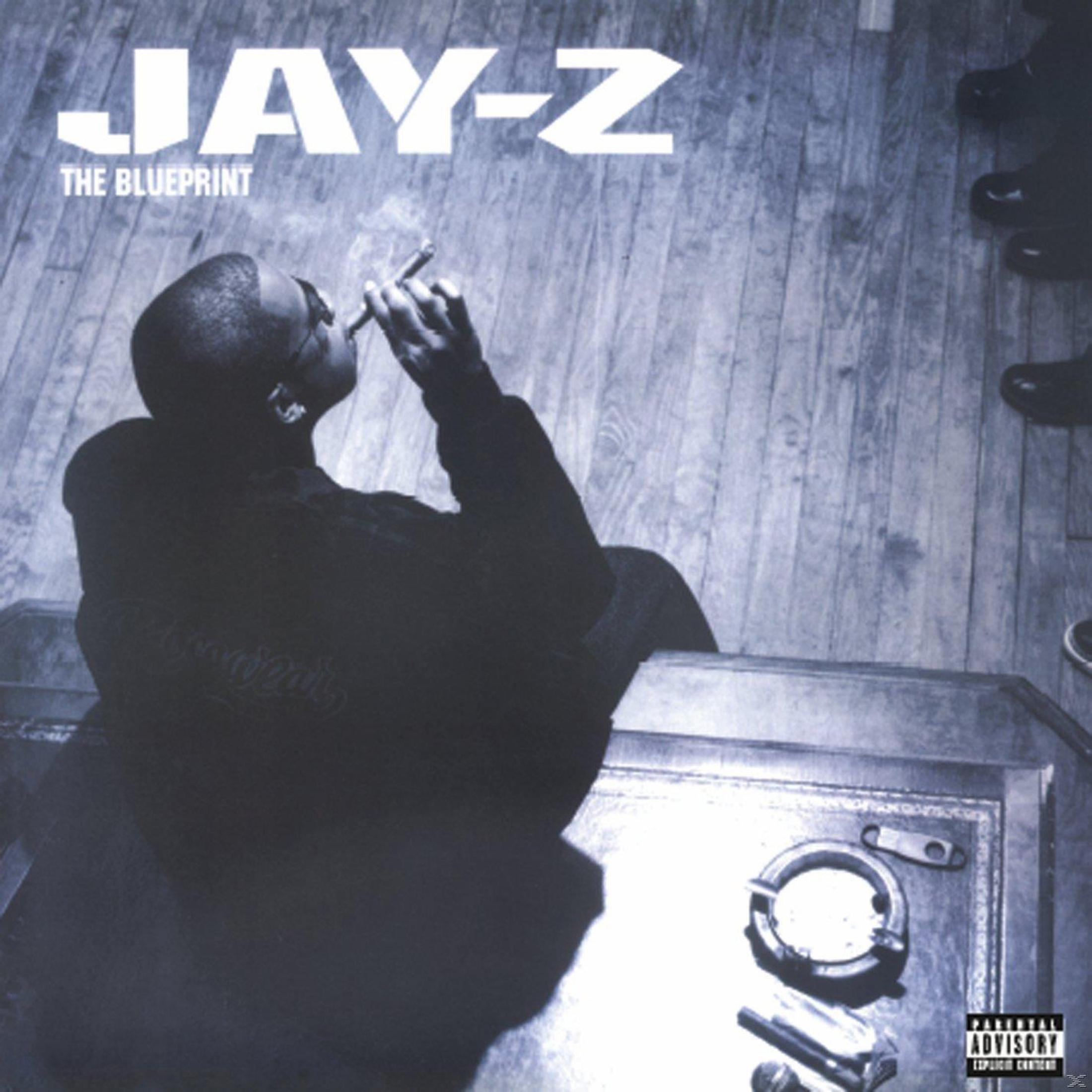 Pochette d'album : Jay-Z fumant un cigare. Le titre est "The Blueprint". Fond de plancher en bois.