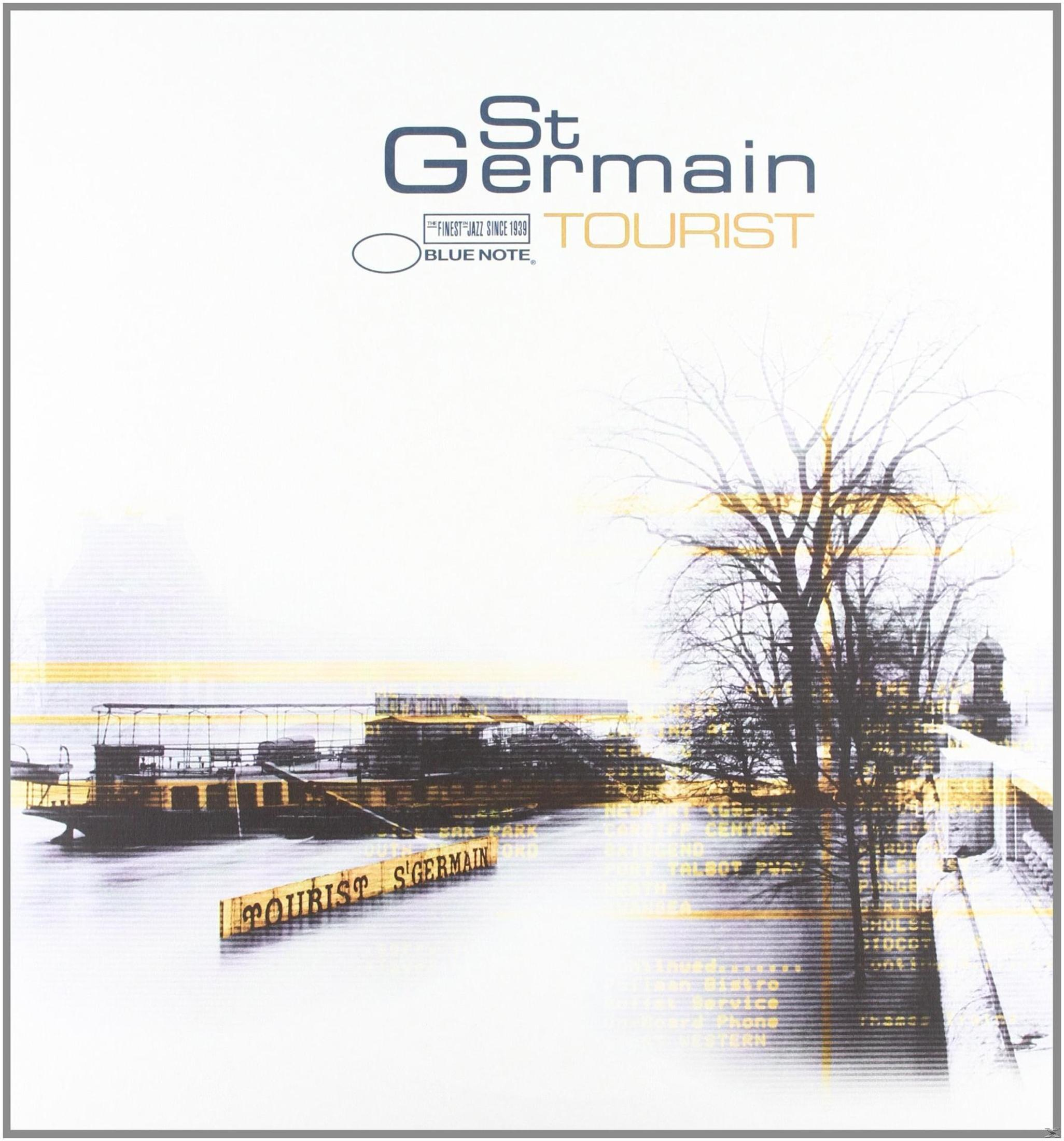 Copertina dell'album: Un design minimalista con testo e un albero stilizzato. La parola 'TOURIST' è prominente.
