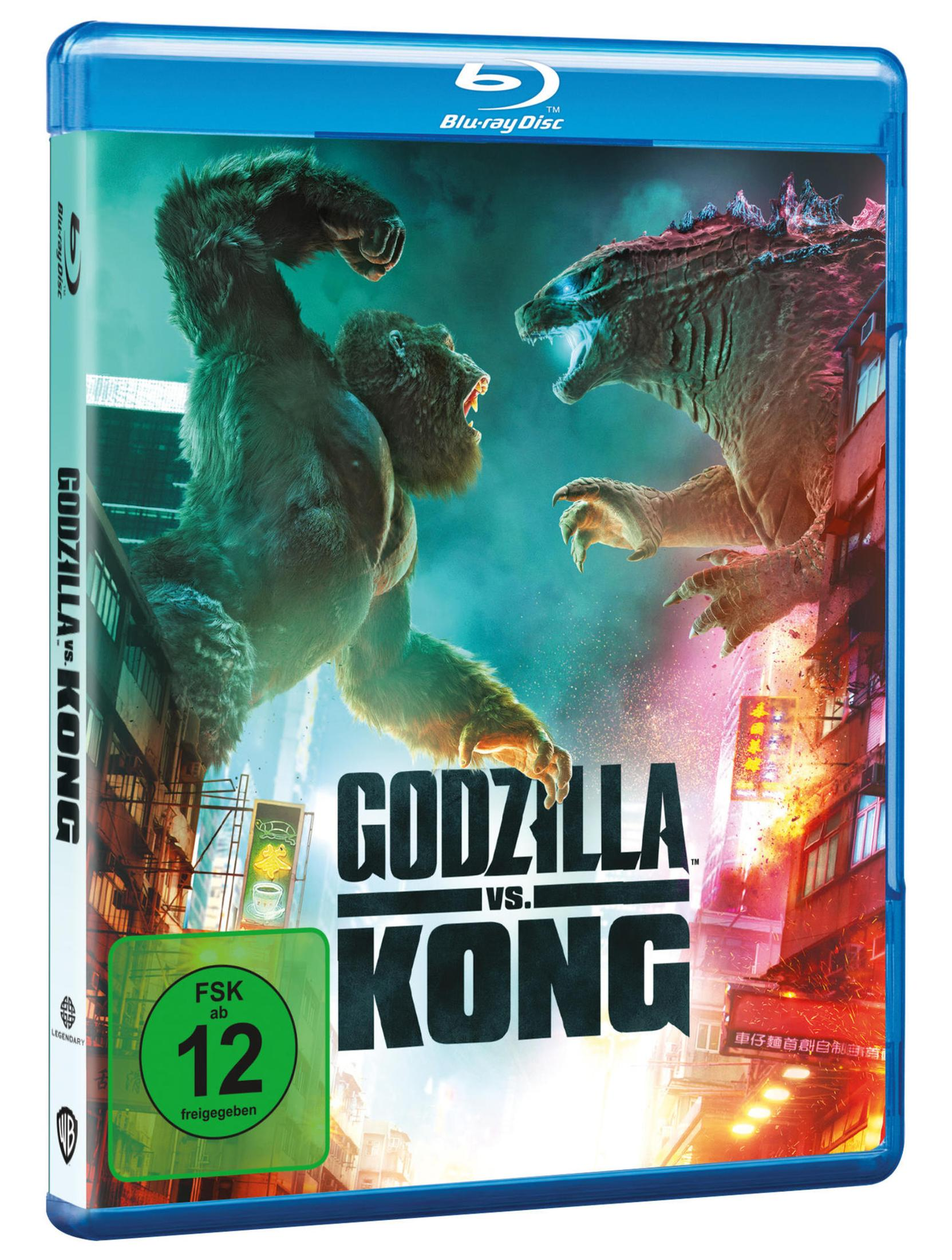 Godzilla und Kong kämpfen vor einer neonbeleuchteten Stadt.