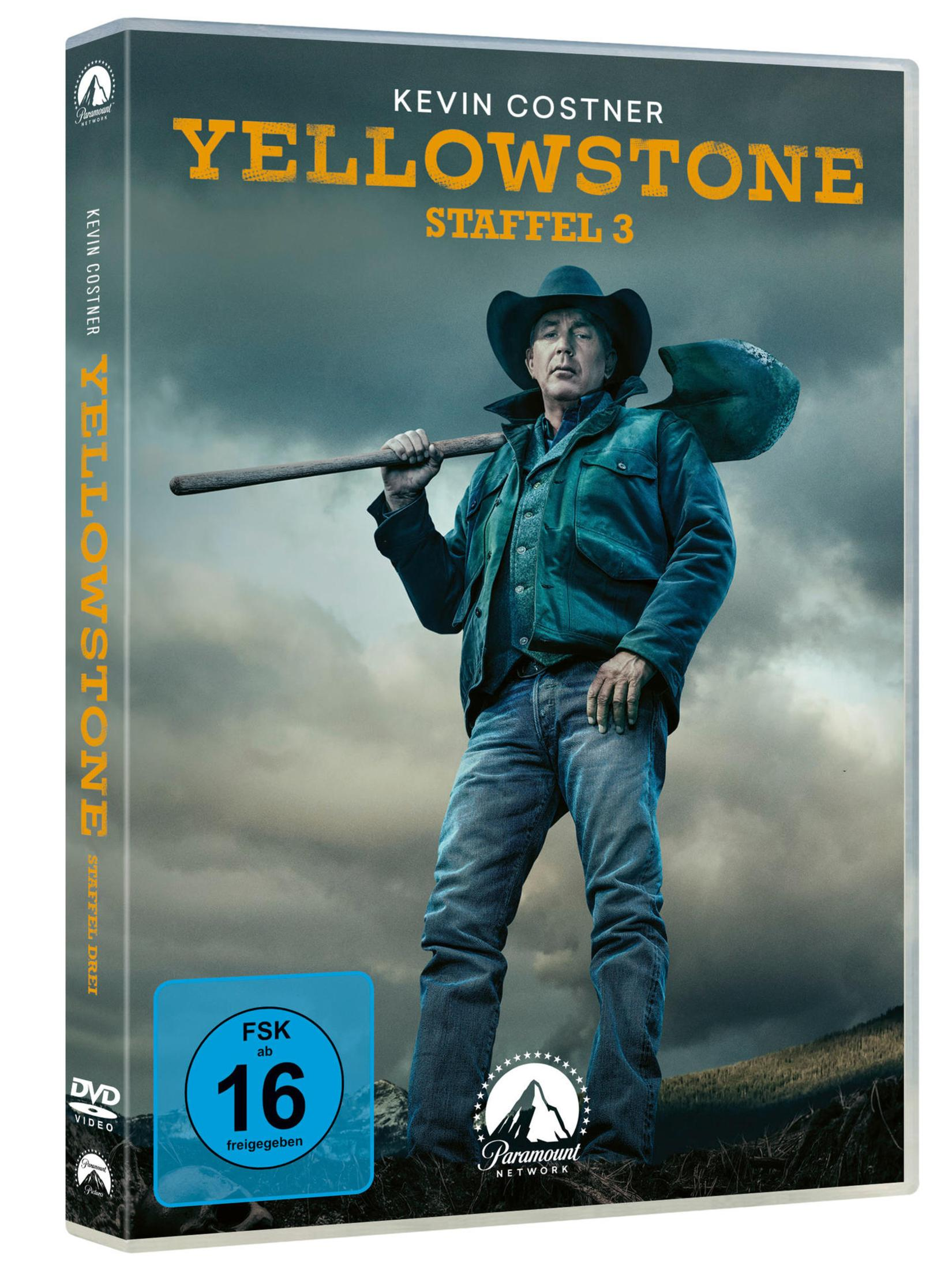 Yellowstone Staffel 3 DVD-Cover mit Kevin Costner und einer Schaufel vor wolkigem Himmel.