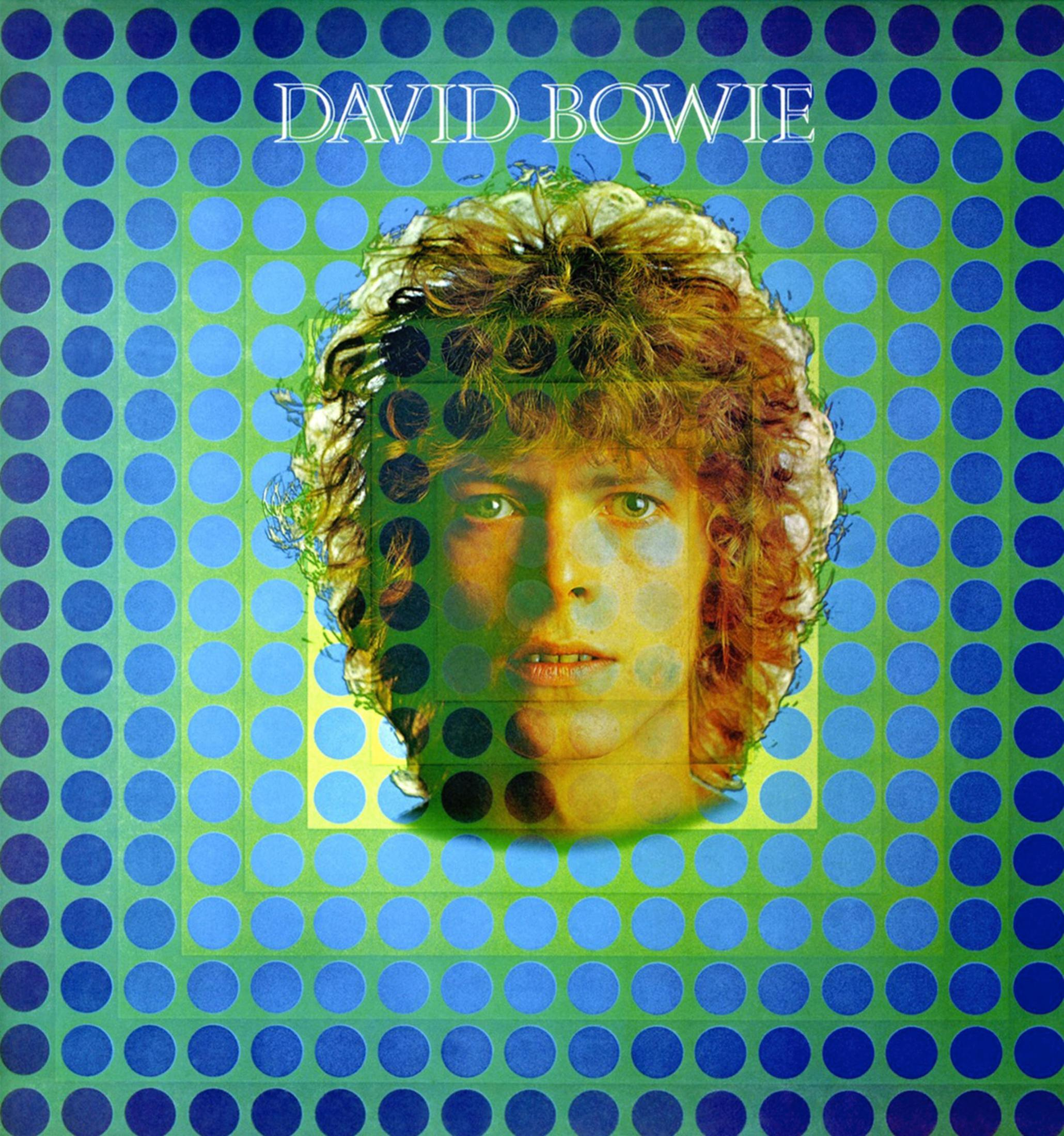 Pochette d'album de David Bowie. Un visage dans un carré de points verts et bleus.
