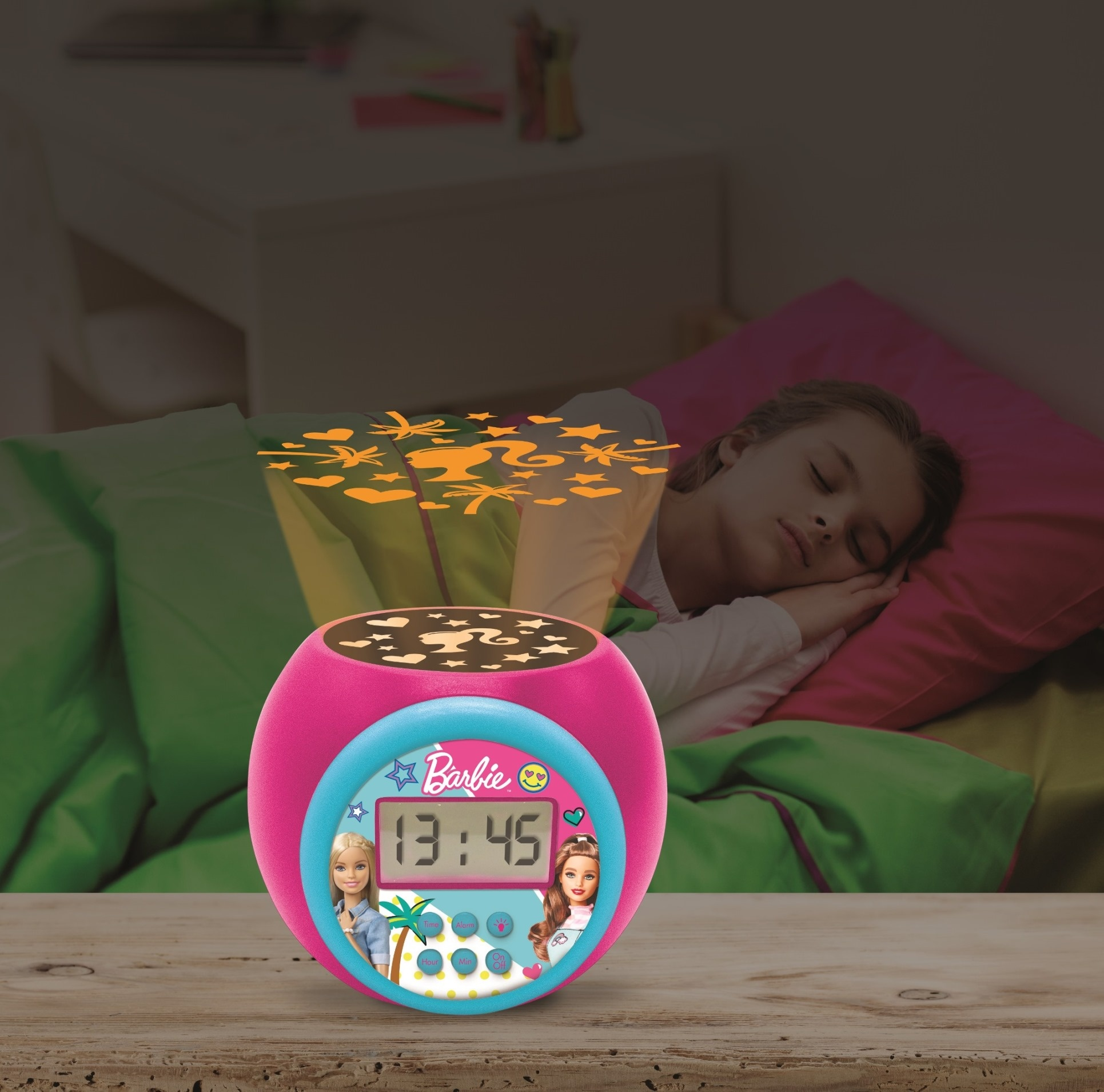 Despertador Barbie rosa con niña durmiendo en el fondo, proyección de estrellas.