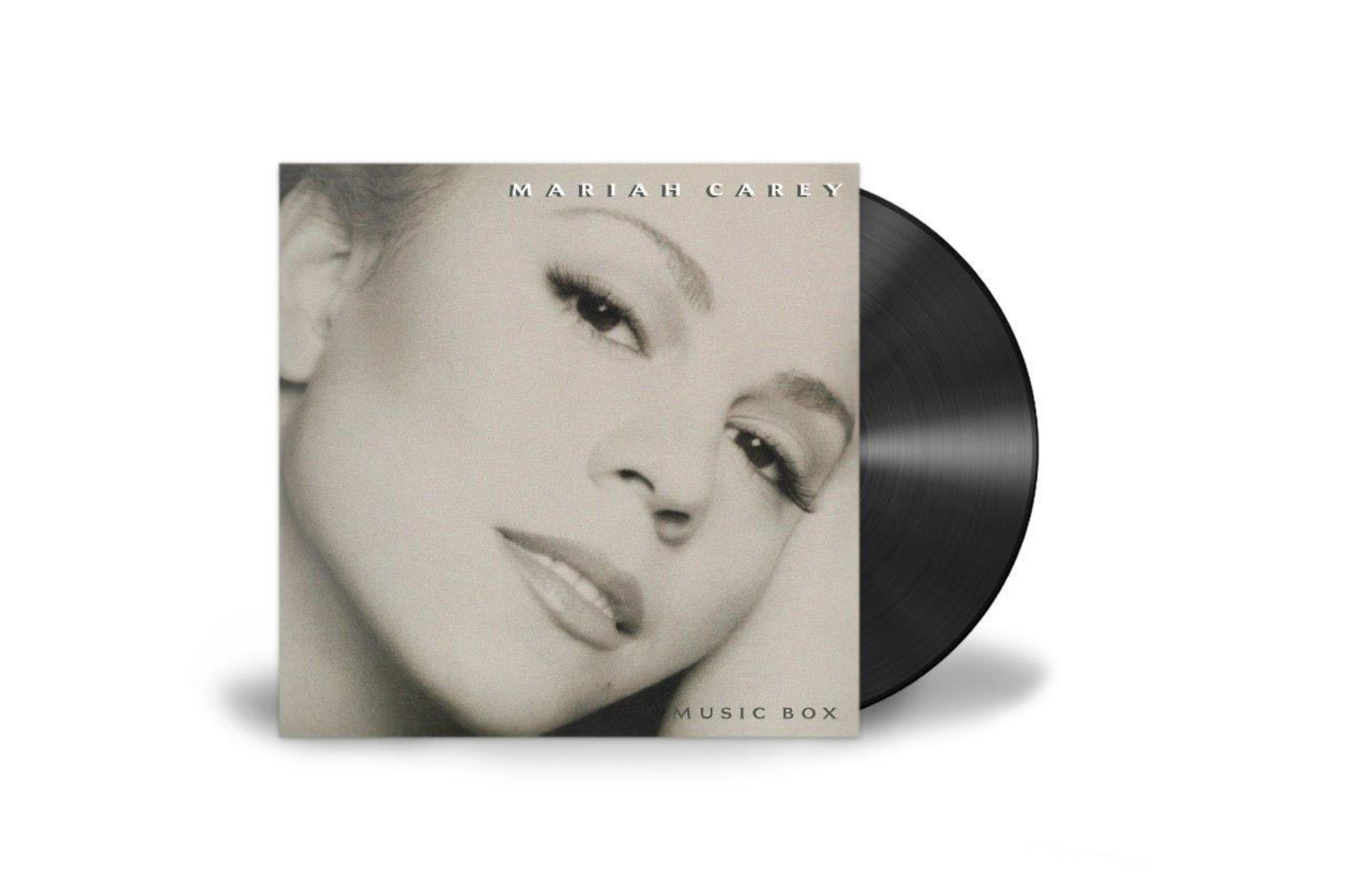 Pochette de l'album de Mariah Carey, photo en noir et blanc de son visage, avec un disque vinyle sur le côté.