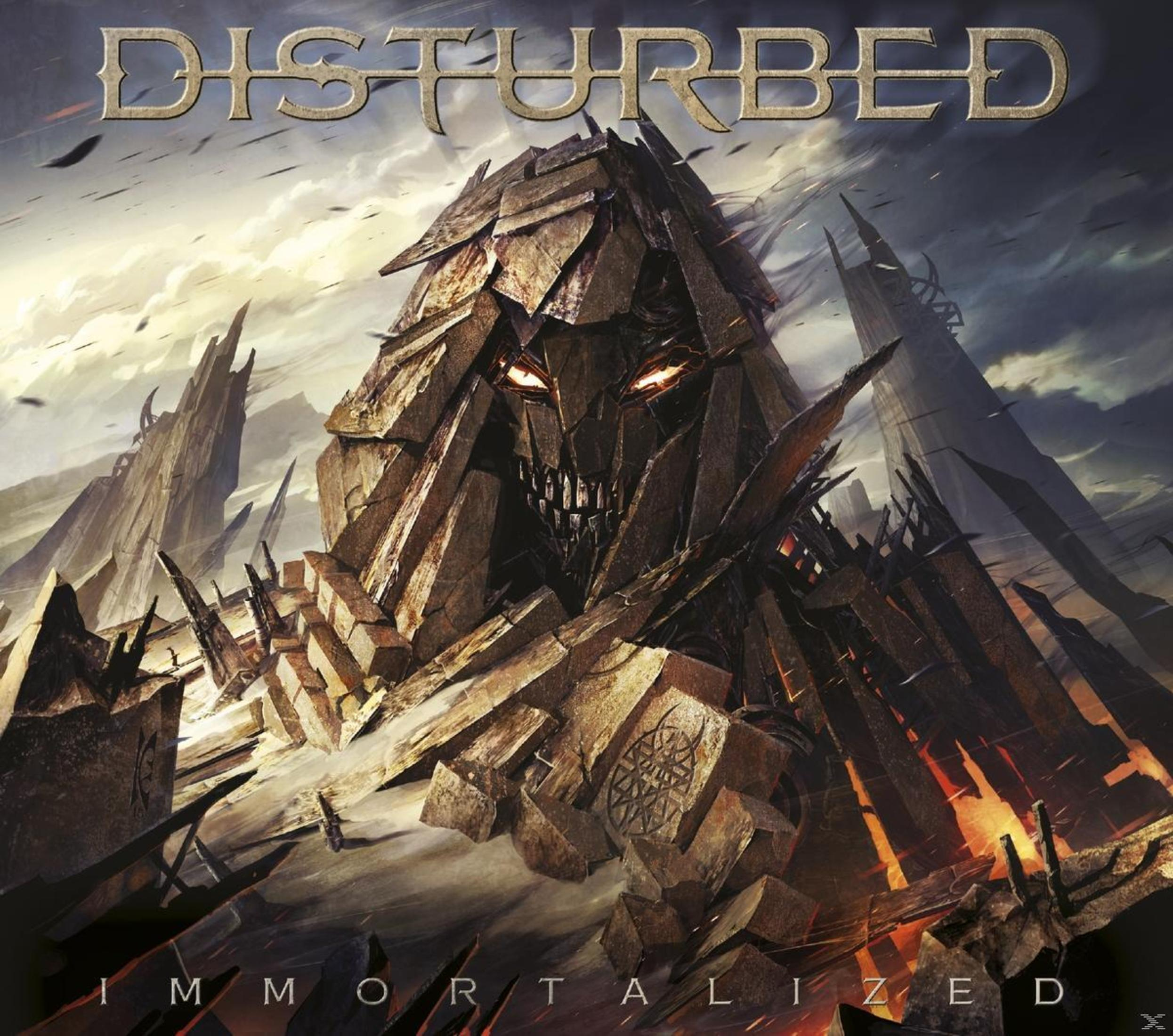 Copertina dell'album dei Disturbed, con una figura oscura e imponente.