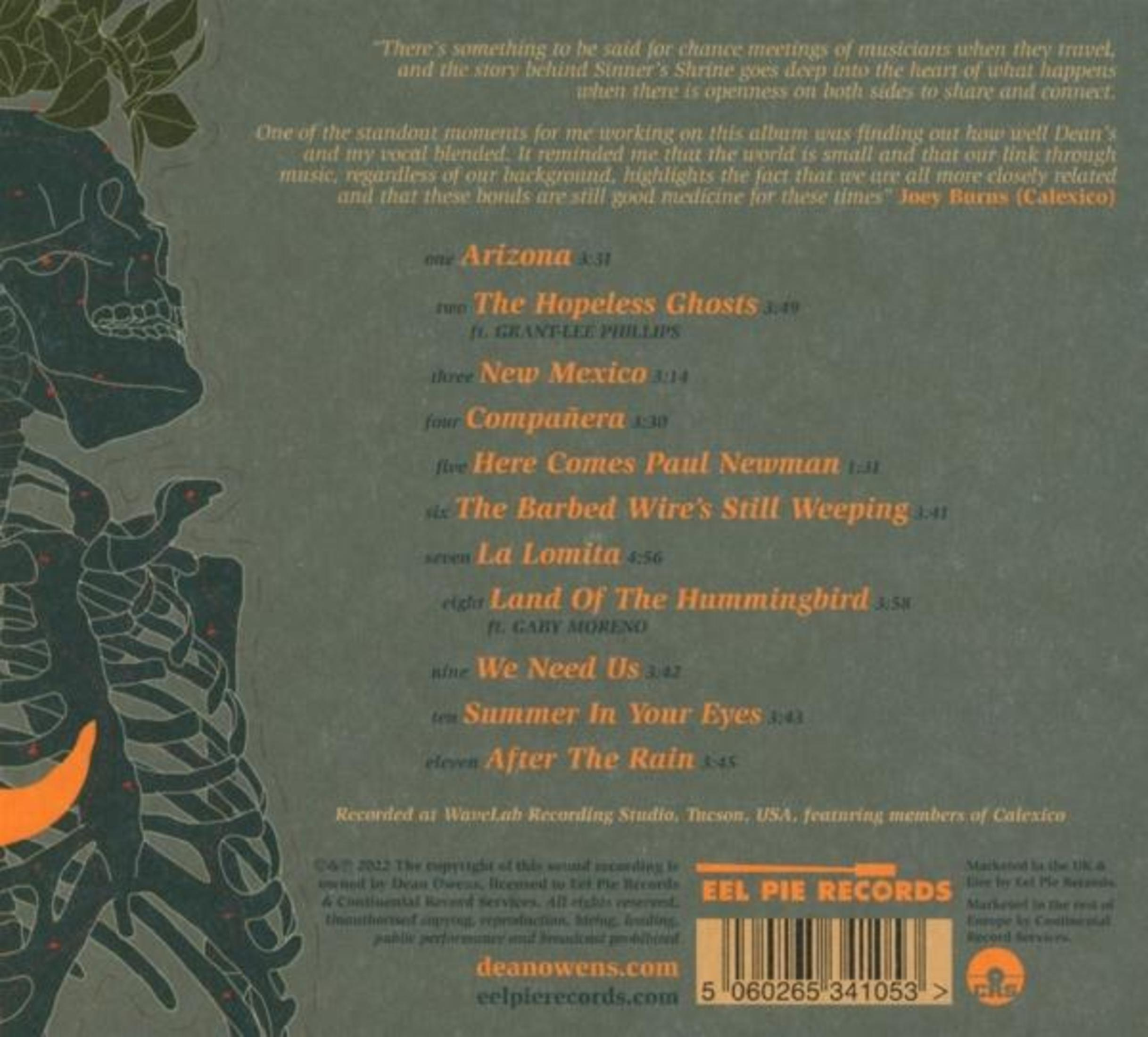 Album met tekst op de achterkant met een skelet en songtitels.