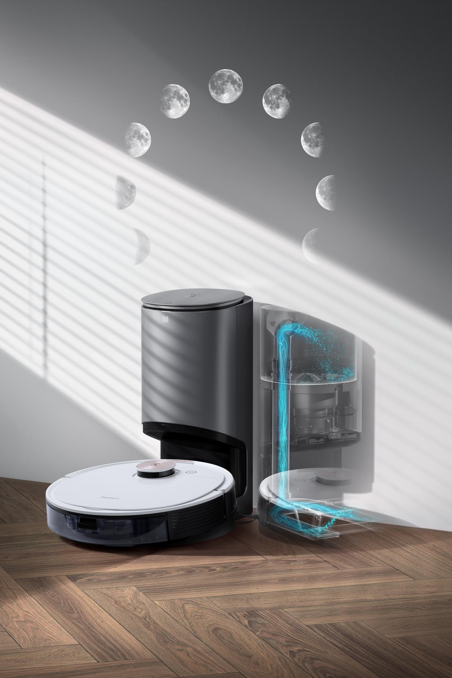 Robot sprzątający. Pokazuje stację czyszczącą, odkurzacz i spuszczaną wodę. Pokazano fazy księżyca.