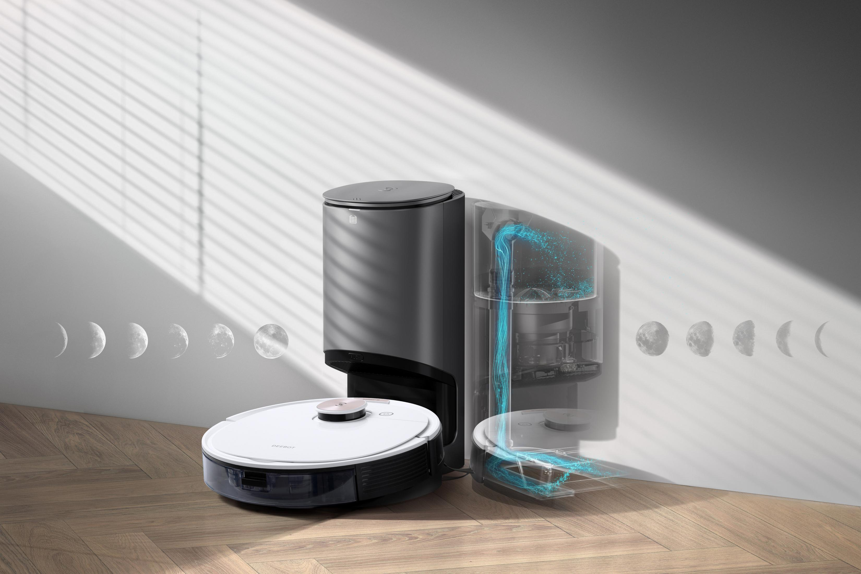 Robot sprzątający z stacją ładującą i zbiornikiem na wodę, z fazami księżyca.