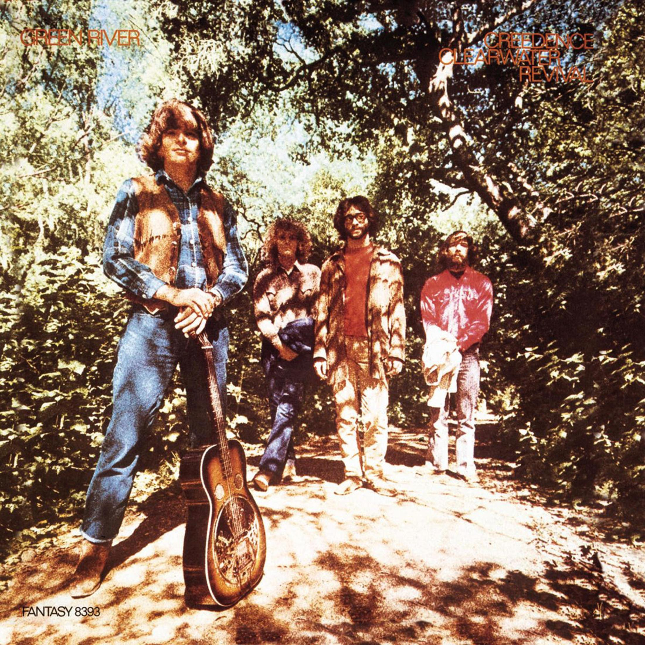 Pochette d'album, quatre hommes dans la forêt, guitares et arbres.