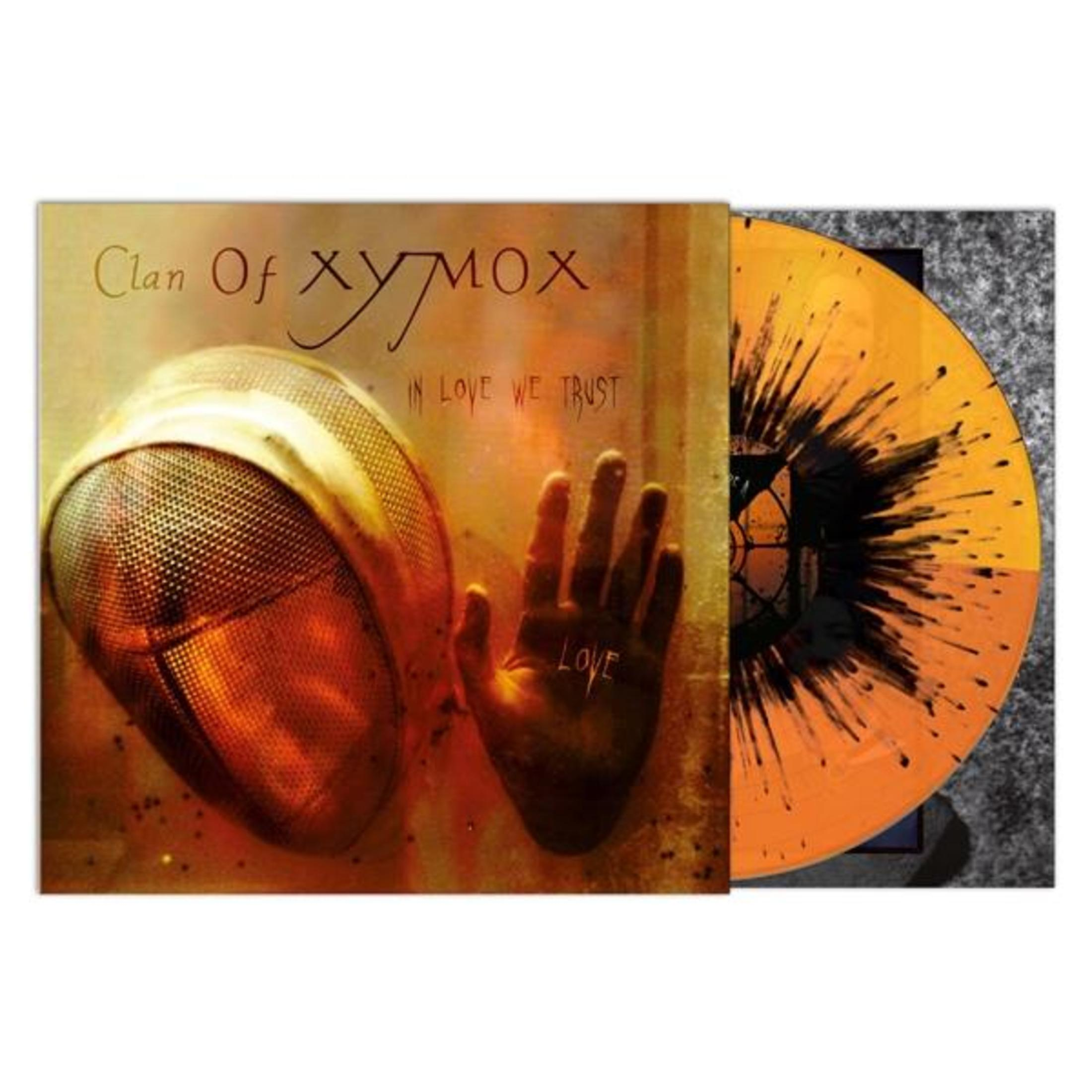 Album cover with a fencing mask and a hand with 'LOVE' written on it, with orange and black vinyl.