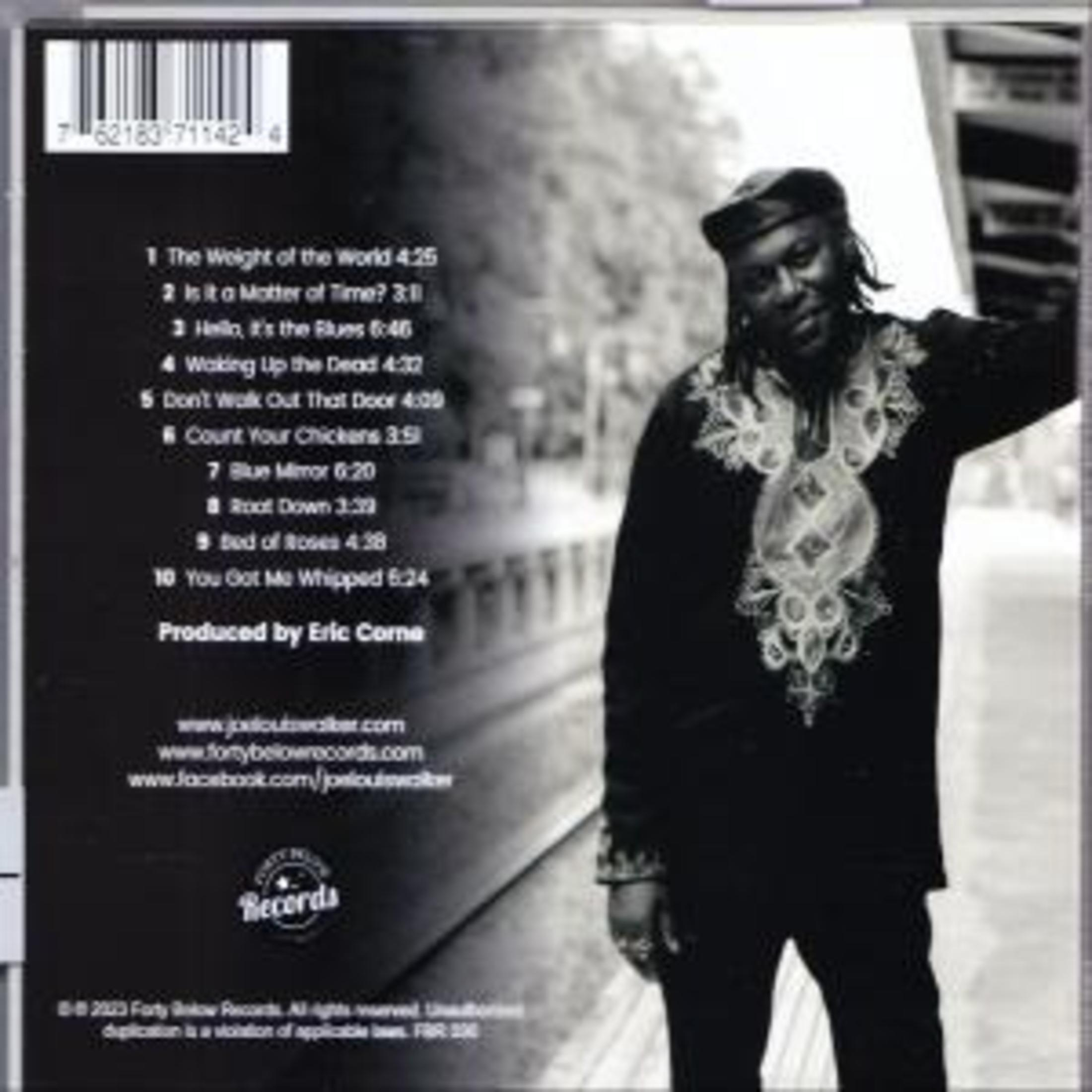 Album cover with a man, song titles, and credits, on a black and white background.