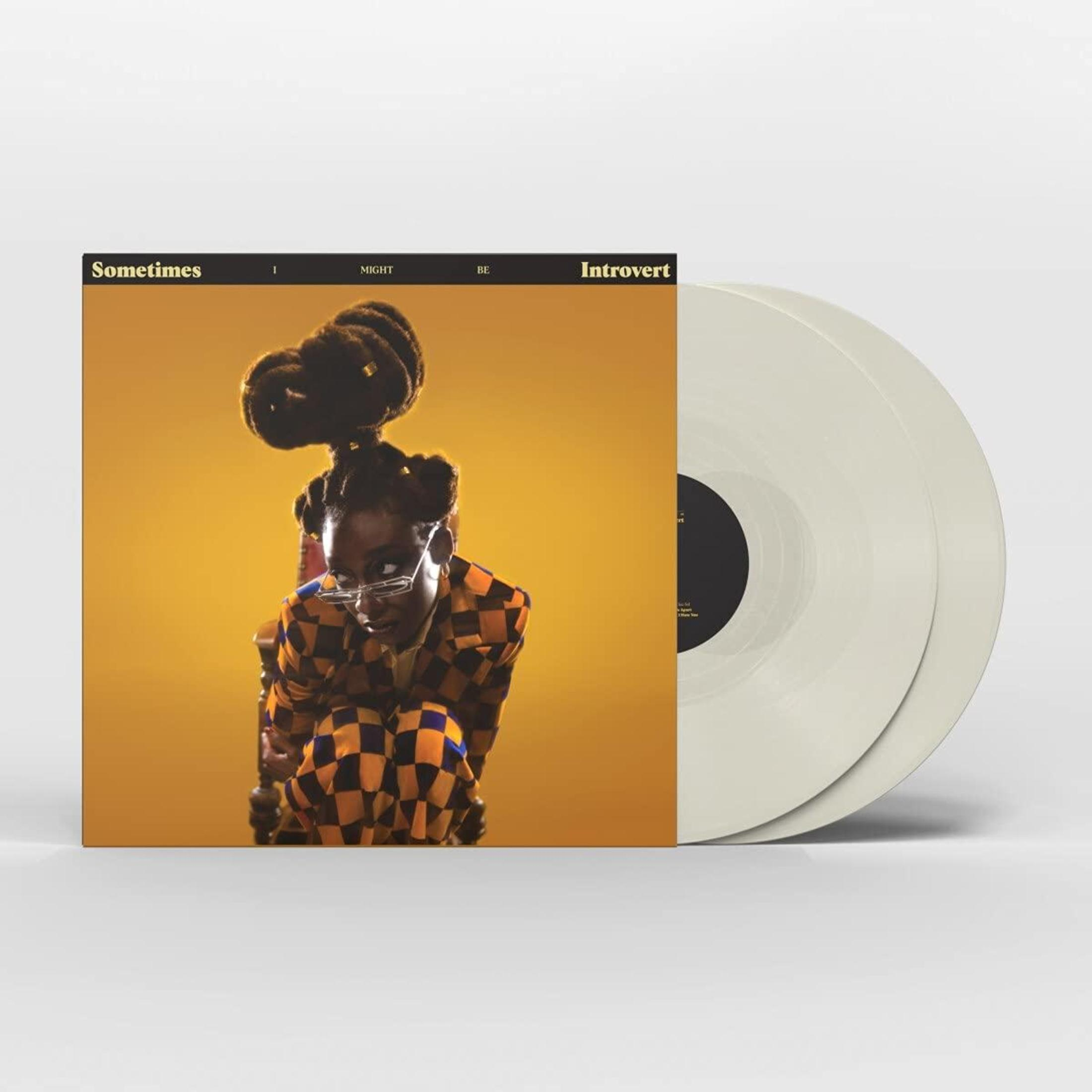 Albumhoes. Vrouw met zwart haar en bril. Album is geel met twee vinyls aan de zijkant.