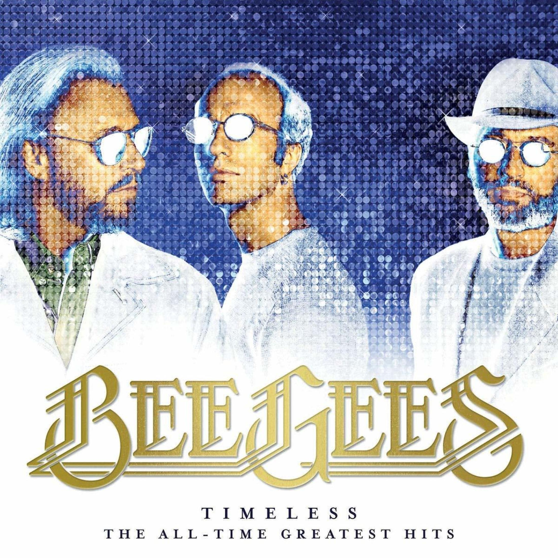 Tre uomini con occhiali, sfondo blu e le parole 'Bee Gees' e 'Timeless' sulla copertina dell'album.