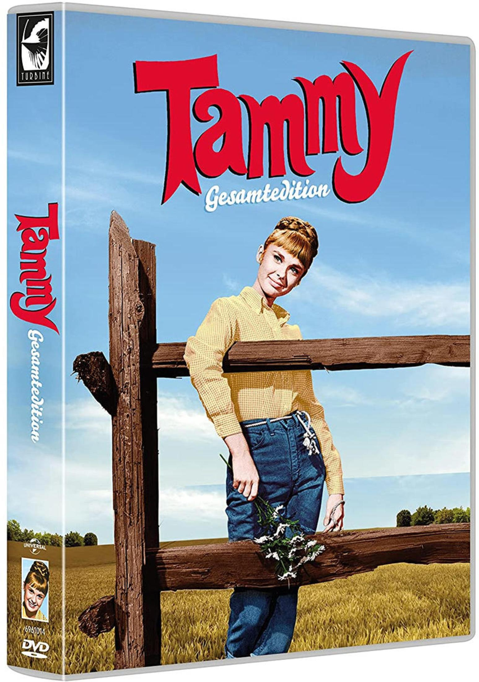 DVD-Cover von Tammy Gesamtedition mit einer blonden Frau in gelbem Hemd und Jeans, stehend an einem Holzzaun.
