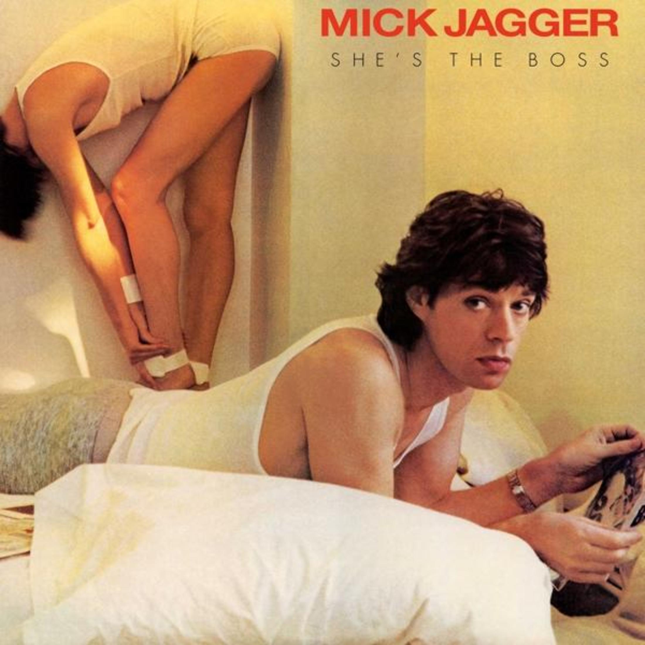 Mick Jagger op bed met een vrouw die overbuigt, albumhoes.